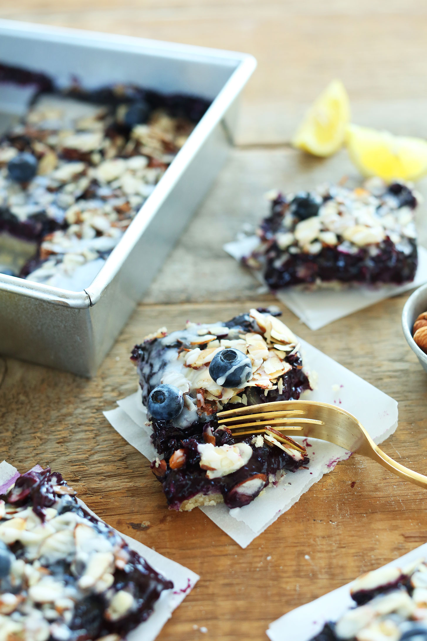 Using a fork to grab a bite of our vegan Almond Blueberry Pie Bar recipe