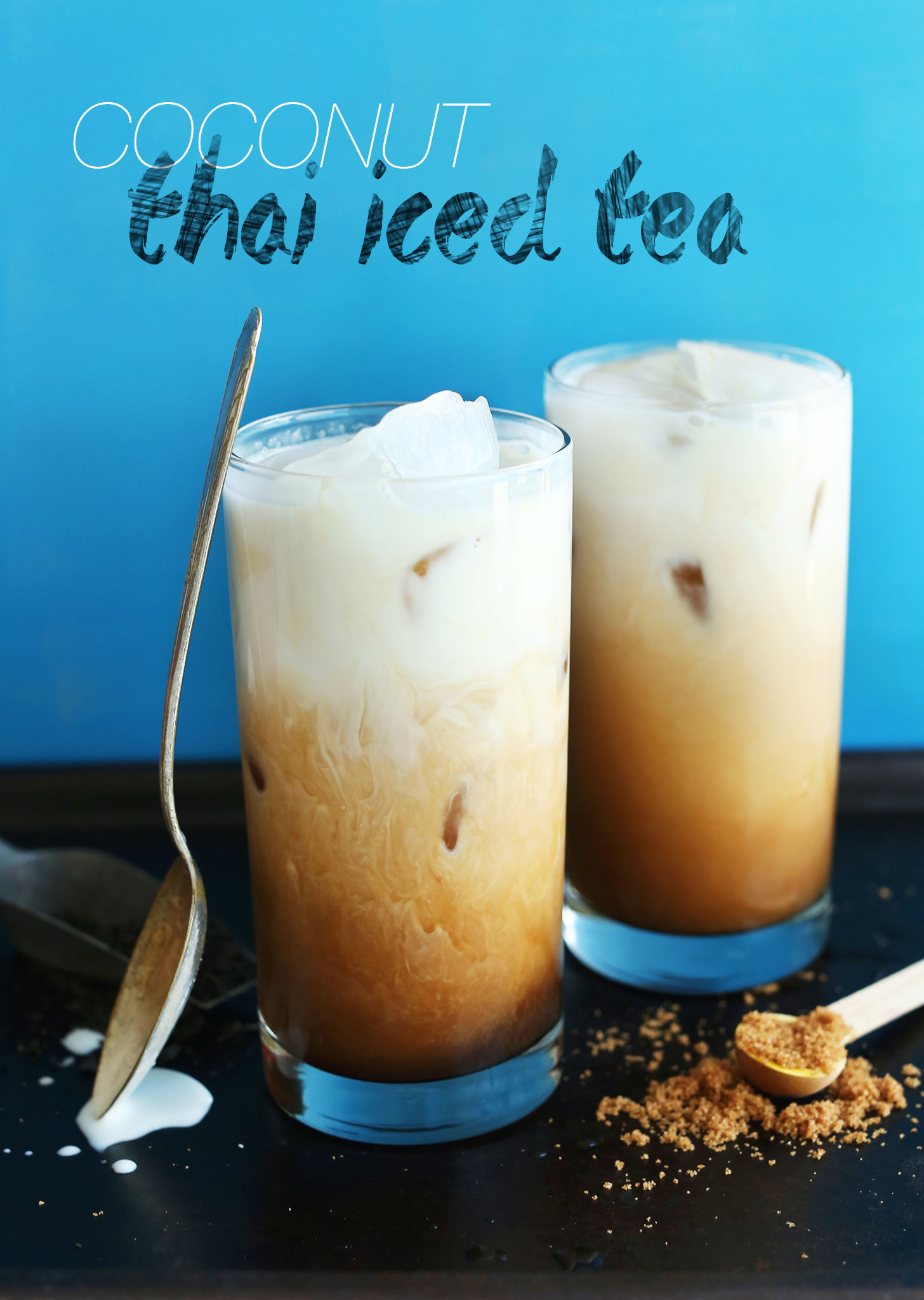 Two glasses of our Coconut Thai Iced Tea made with black tea, vanilla, natural sweeteners, and coconut milk