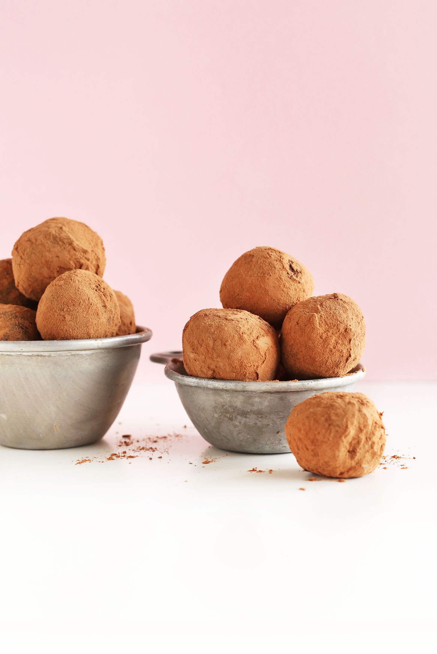 Measuring cups filled with our homemade super simple vegan Dark Chocolate Truffles recipe