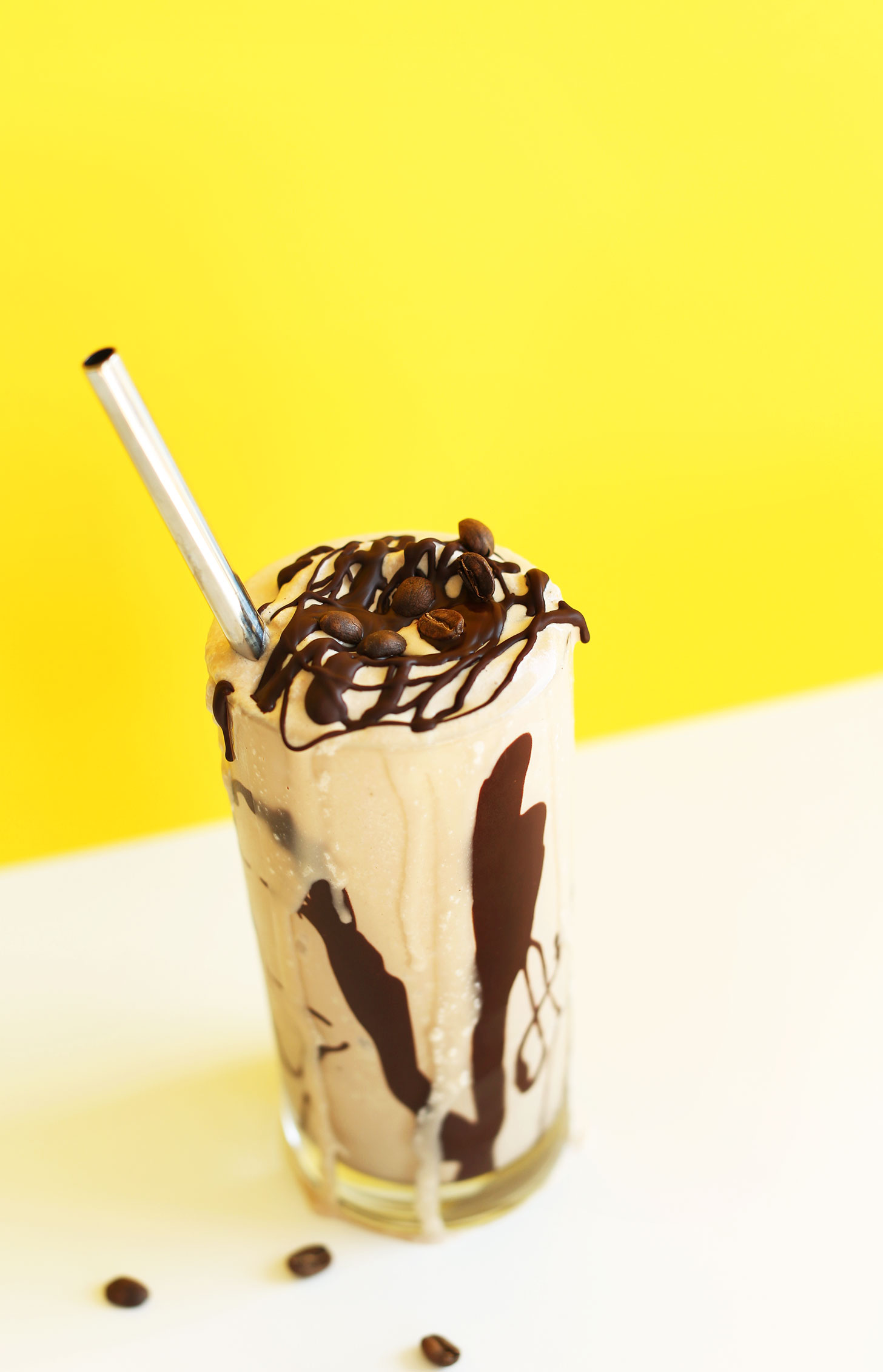 Overflowing mug of a milkshake topped with Vegan Chocolate Shell