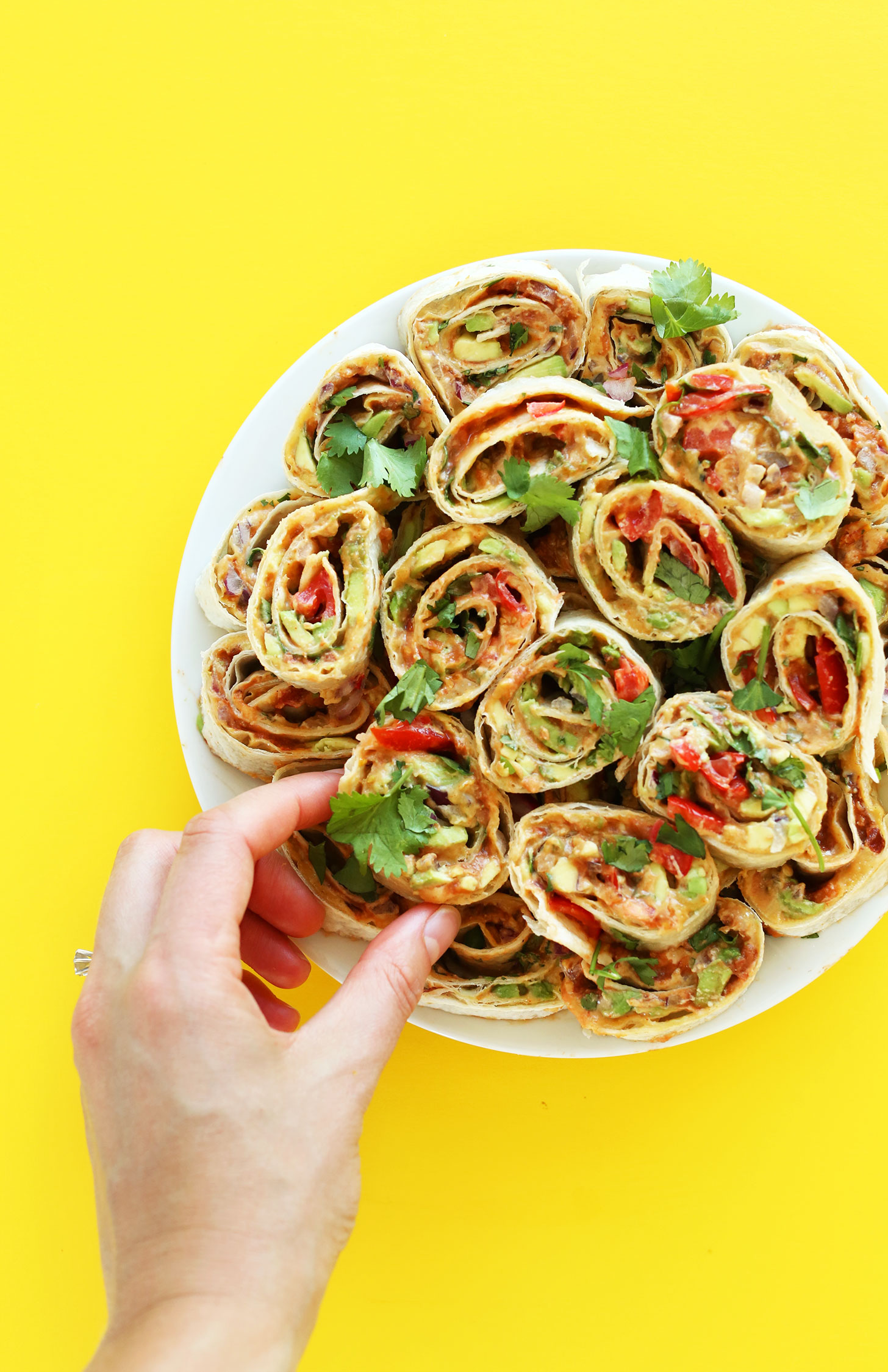 Plate of Mexican Pinwheels for the perfect vegan finger food