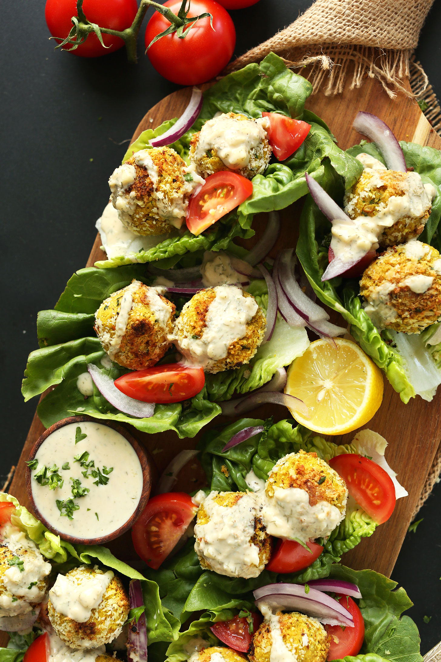 Lettuce wraps filled with our Turmeric Chickpea Fritters recipe and fresh vegetables