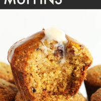 Stack of blackberry cornmeal muffins topped with melting vegan butter