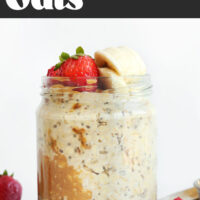 Jar of peanut butter overnight oats topped with strawberries and banana