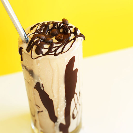Glass of a vegan milkshake topped with our recipe for How to Make Magic Shell