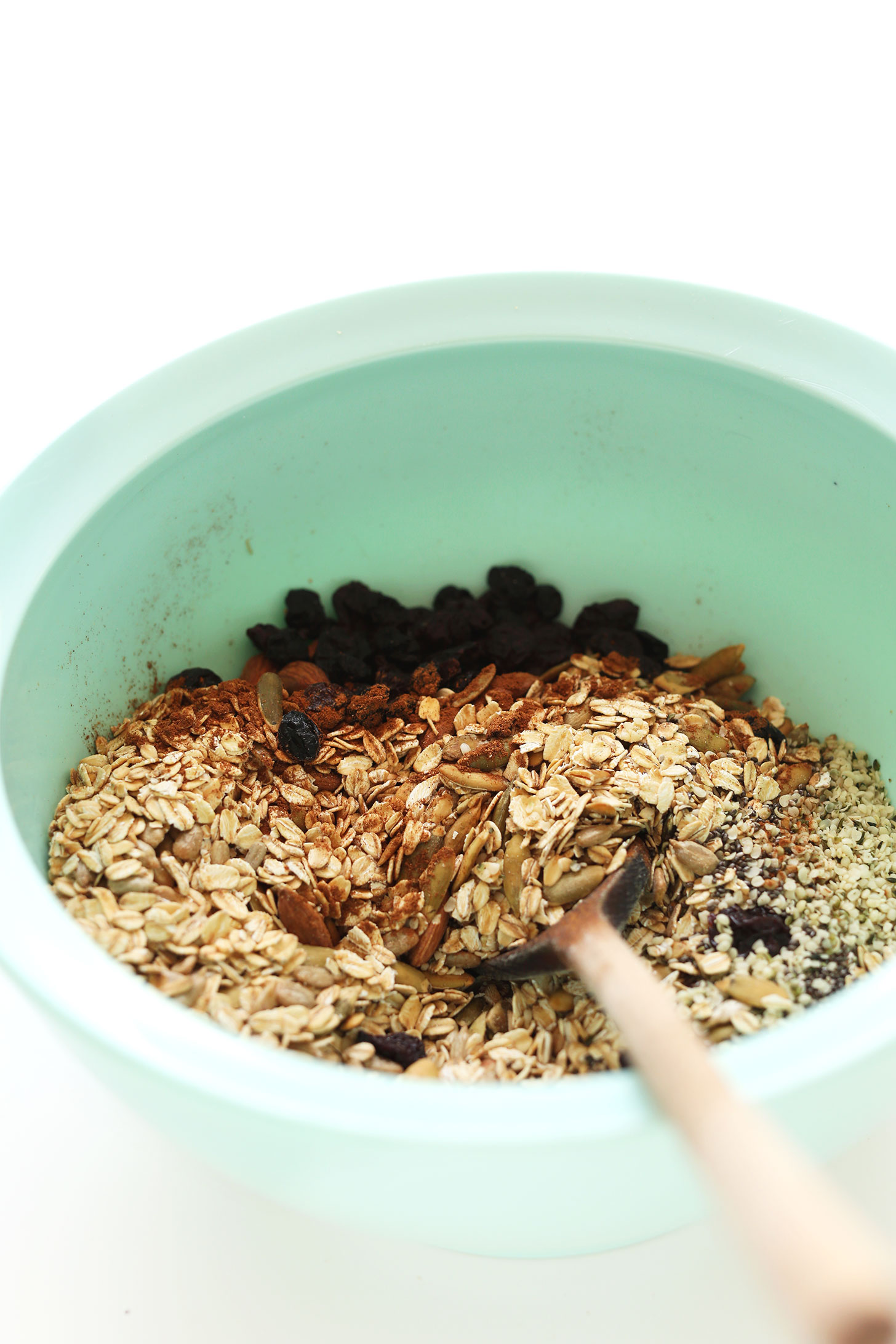 Stirring together ingredients for gluten-free vegan Toasted Pumpkin Muesli