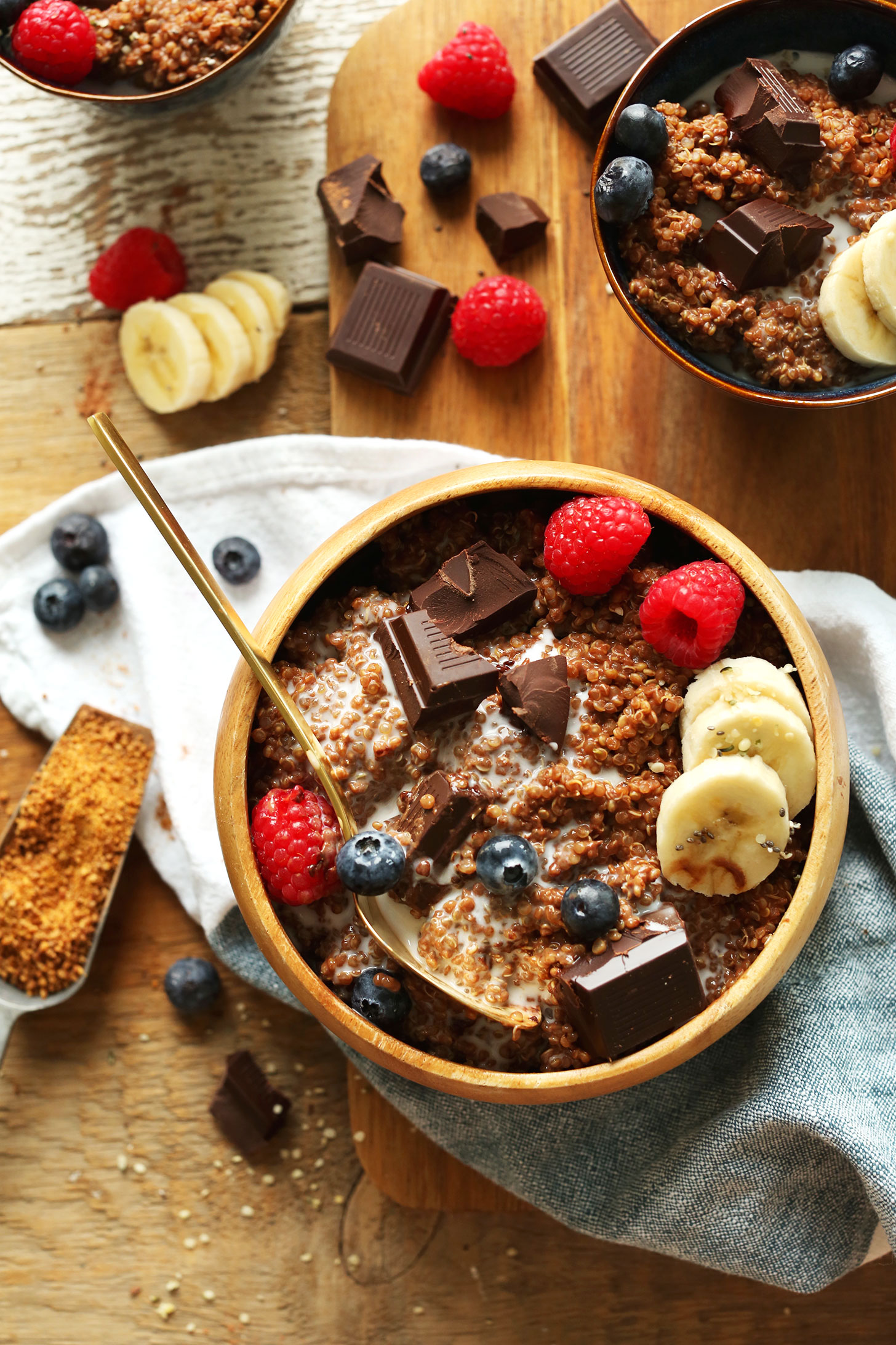 Grabbing a bite of our Dark Chocolate Quinoa Breakfast Bowl with fresh berries and banana