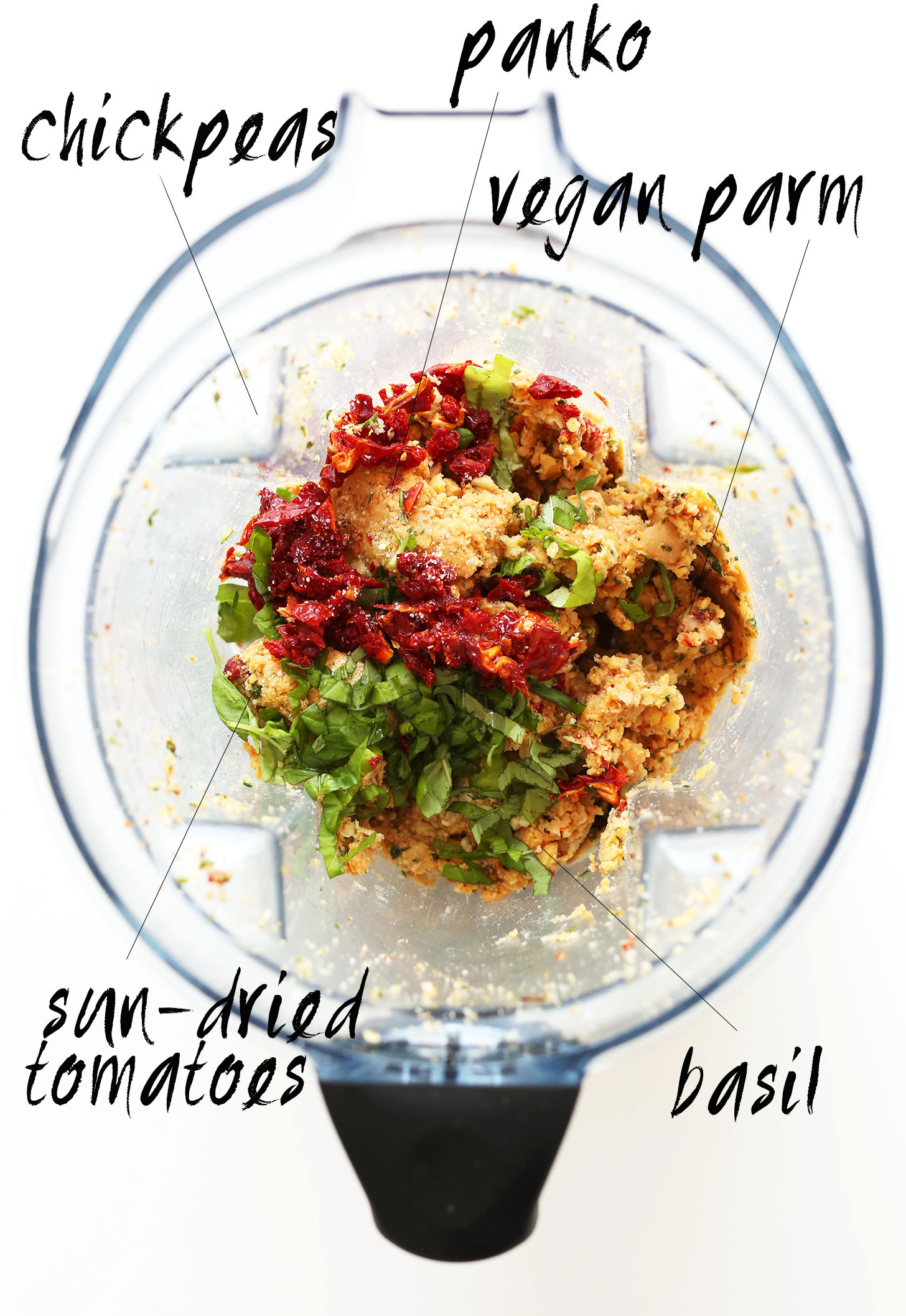 Blender with panko, chickpeas, vegan parmesan, basil, and sun-dried tomatoes for making vegan meatballs