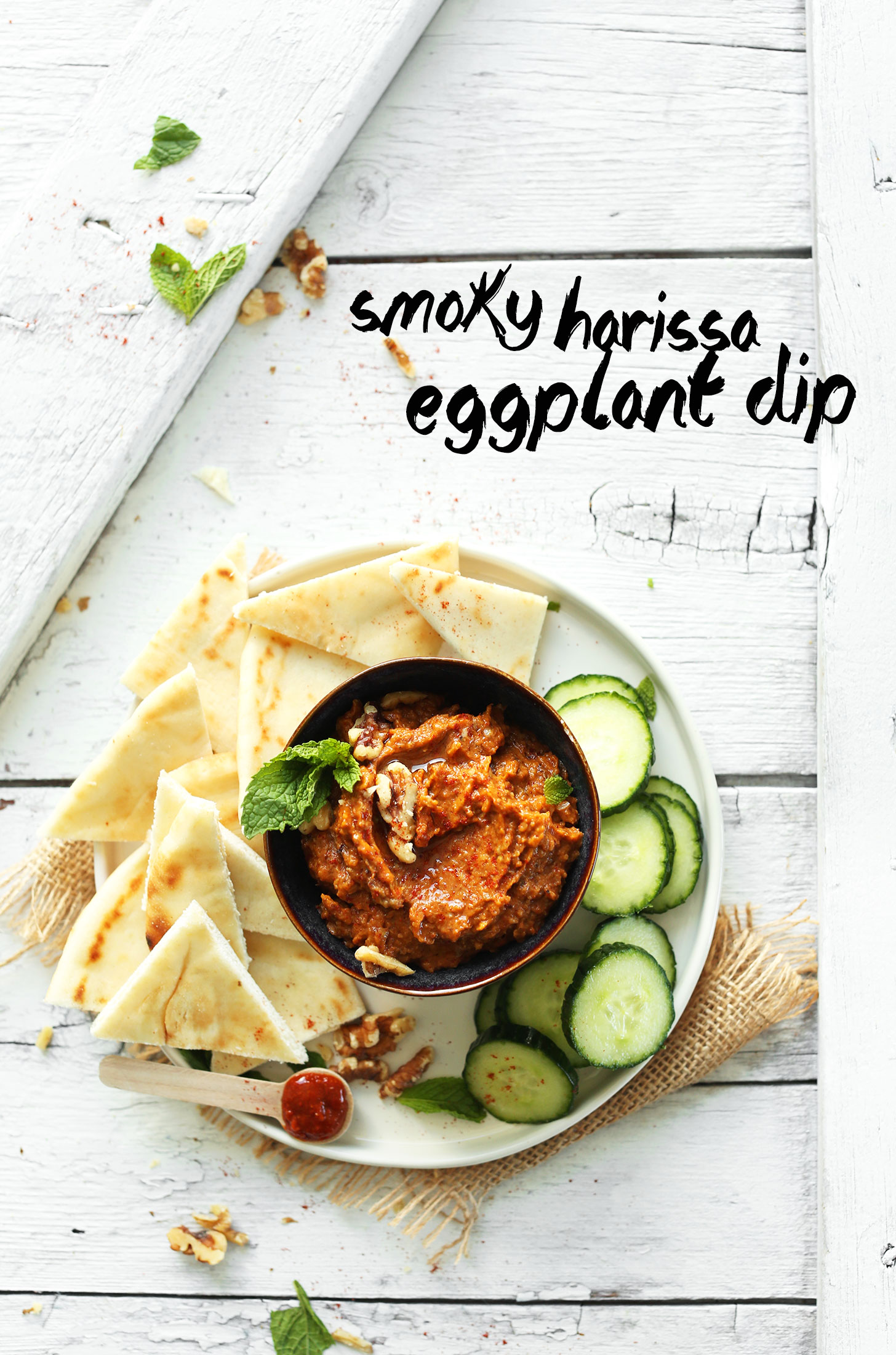 Bowl of our Smoky Eggplant Dip alongside goodies for dipping for the perfect vegan appetizer