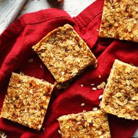 Homemade crunchy PB Granola Bars on a red linen