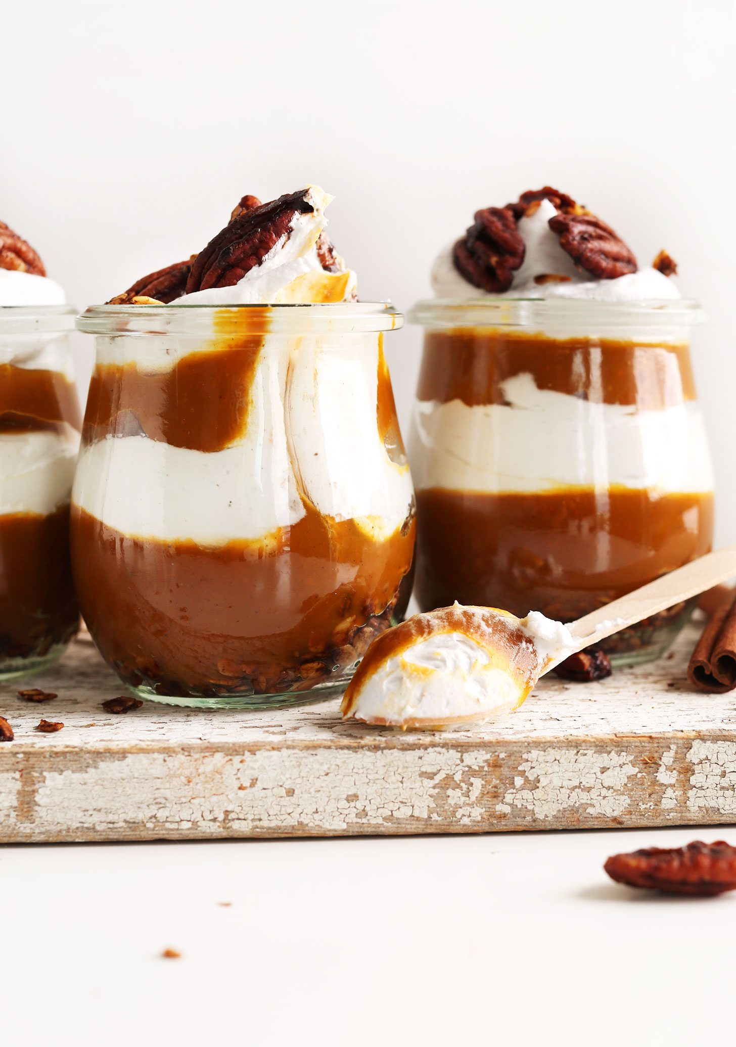 Grabbing a spoonful of Pumpkin Pie Parfait for a delicious fall dessert