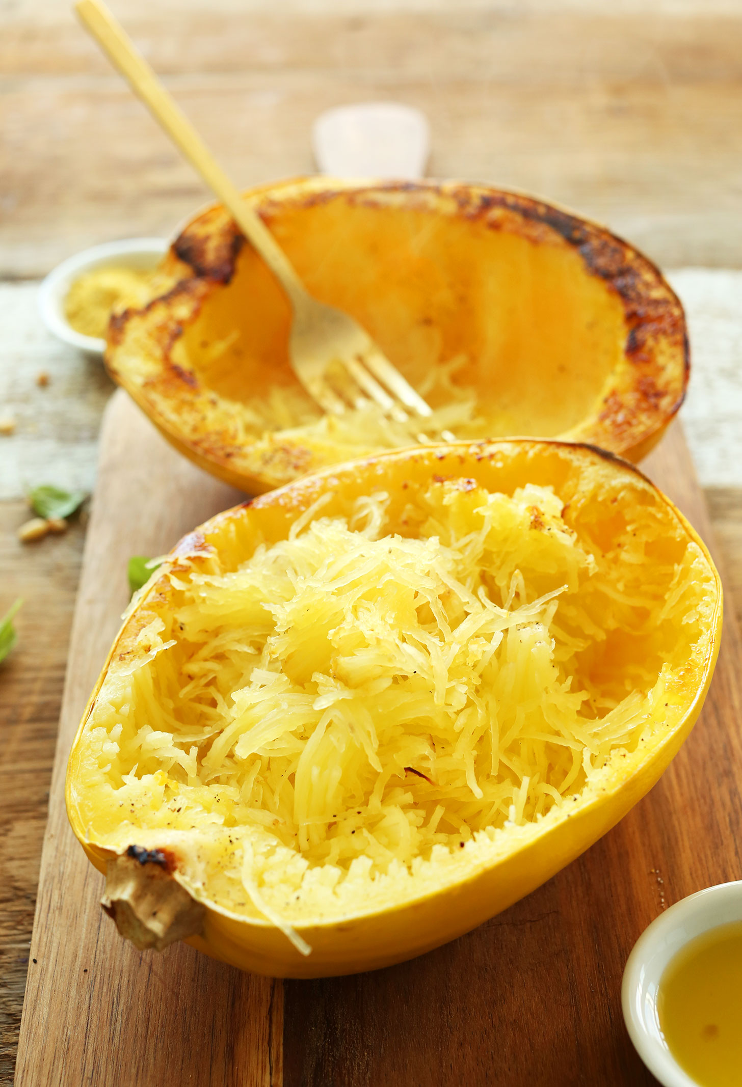 Freshly baked spaghetti squash prepared into strands for making an easy gluten-free vegan dinner