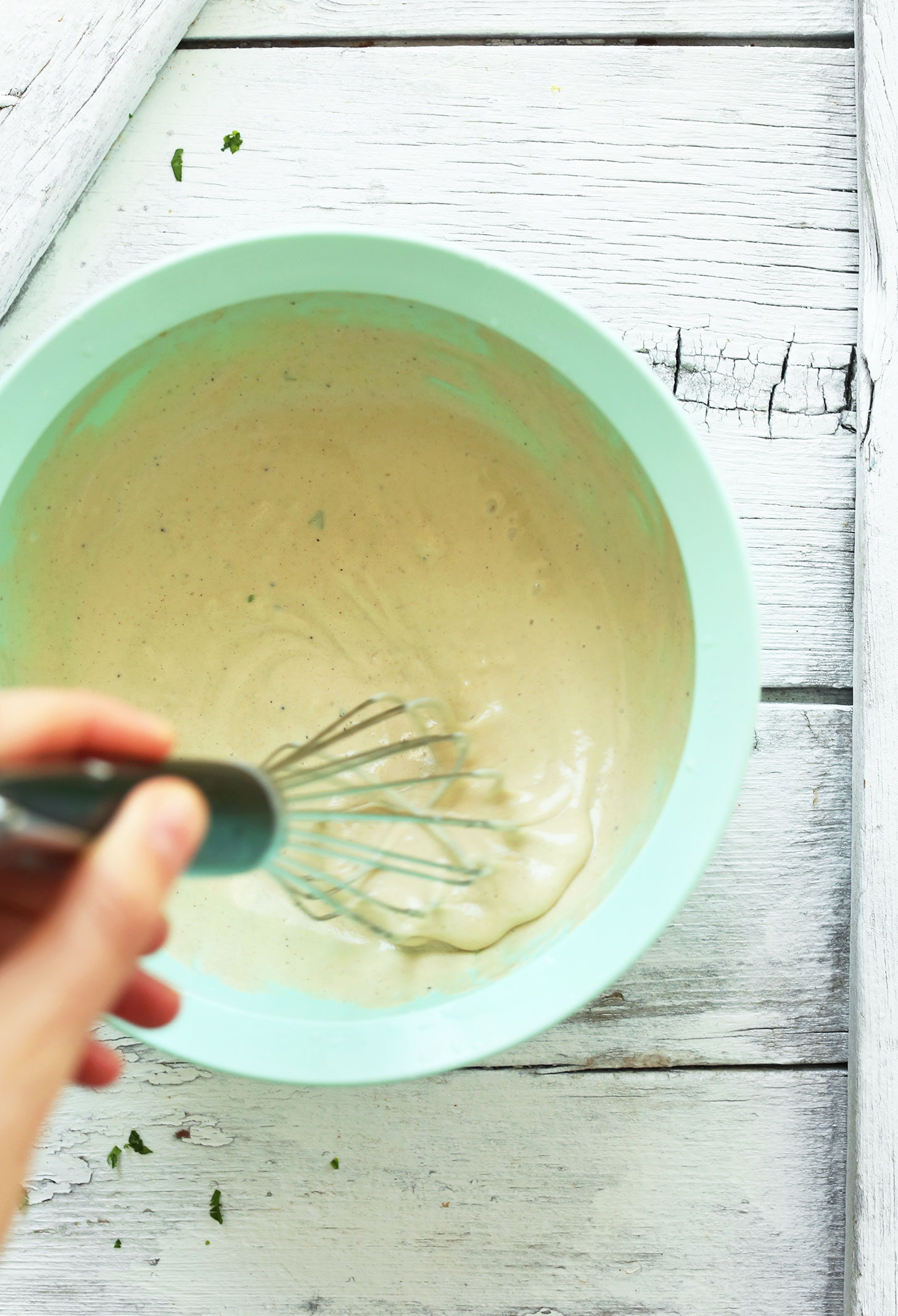 Whisking ingredients for homemade vegan Garlic Tahini Dressing