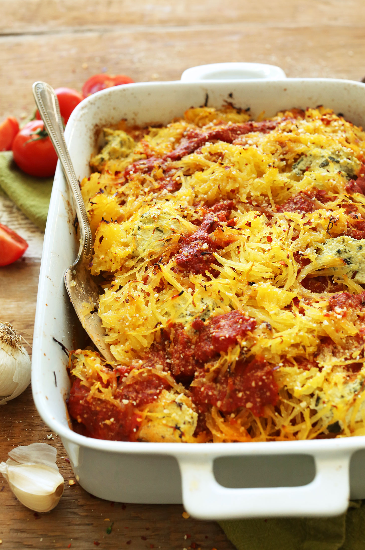 Ceramic baking dish filled with our gluten-free vegan Spaghetti Squash Lasagna Bake recipe