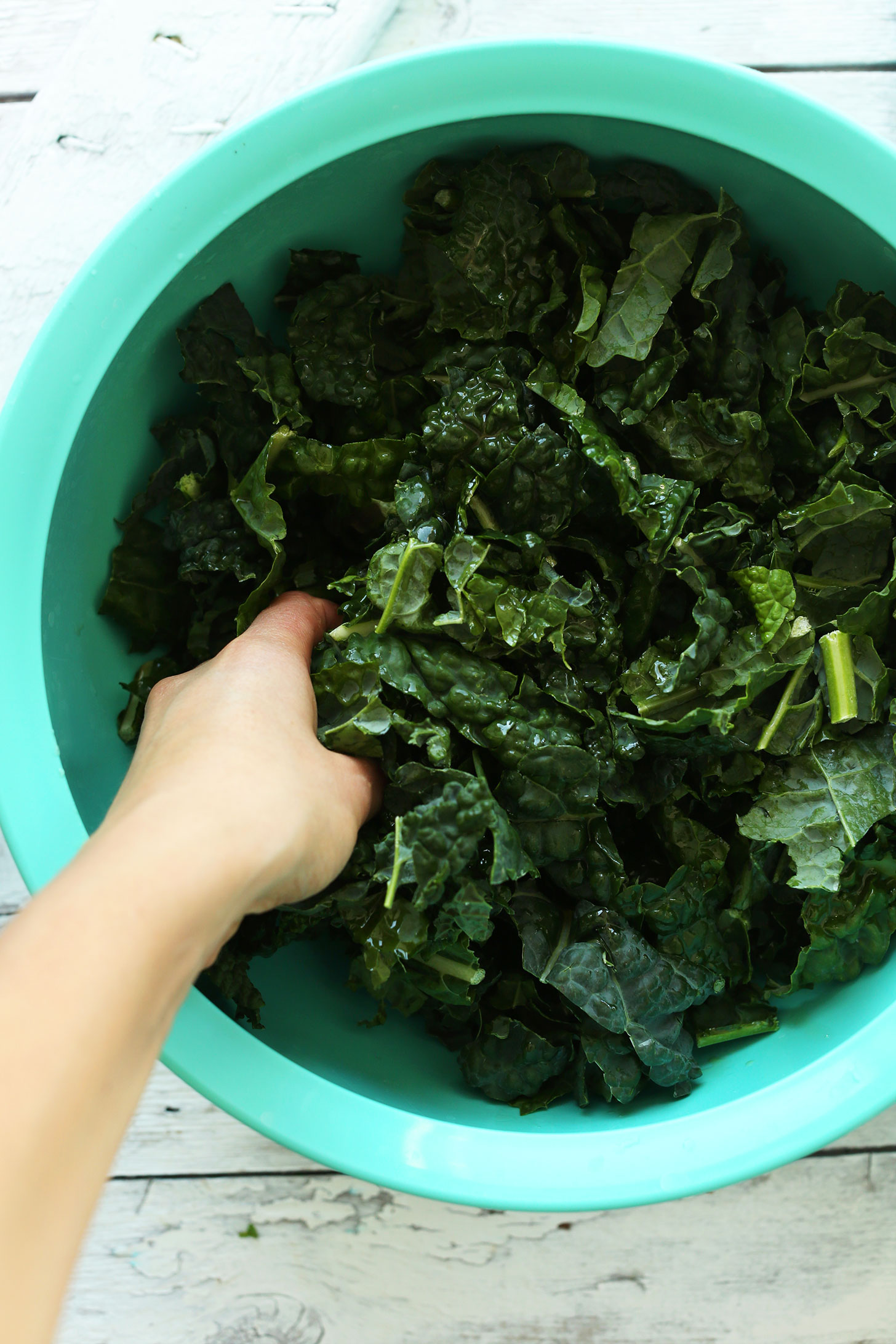 Massaging kale for a delicious vegan whole meal salad recipe