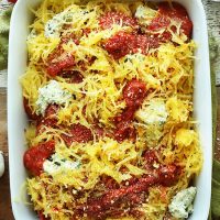 Top down shot of a ceramic dish filled with Vegan Spaghetti Squash Lasagna Bake