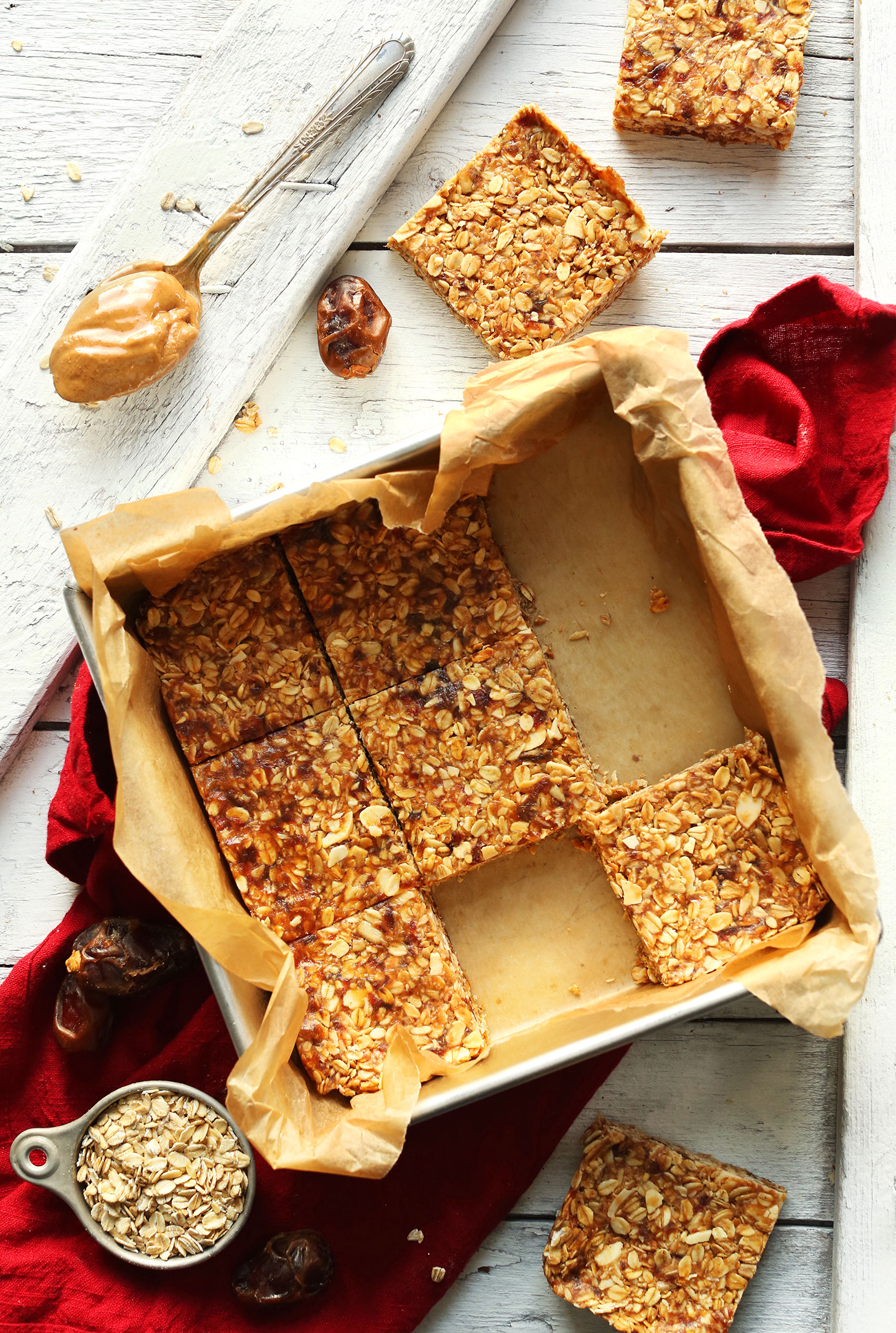 Parchment-lined baking pan with our gluten-free vegan Peanut Butter Granola Bars