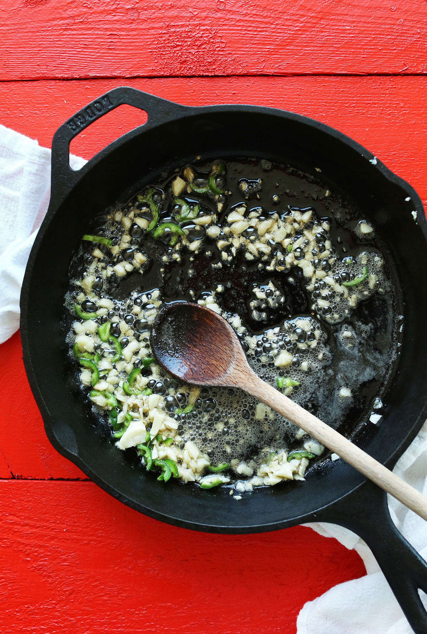 Sautéing peppers and garlic for homemade Vegan Green Chili Queso
