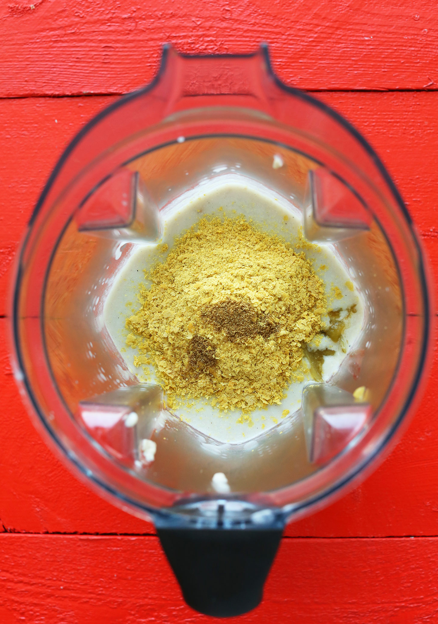Blender with ingredients for our creamy Vegan Green Chili Queso recipe