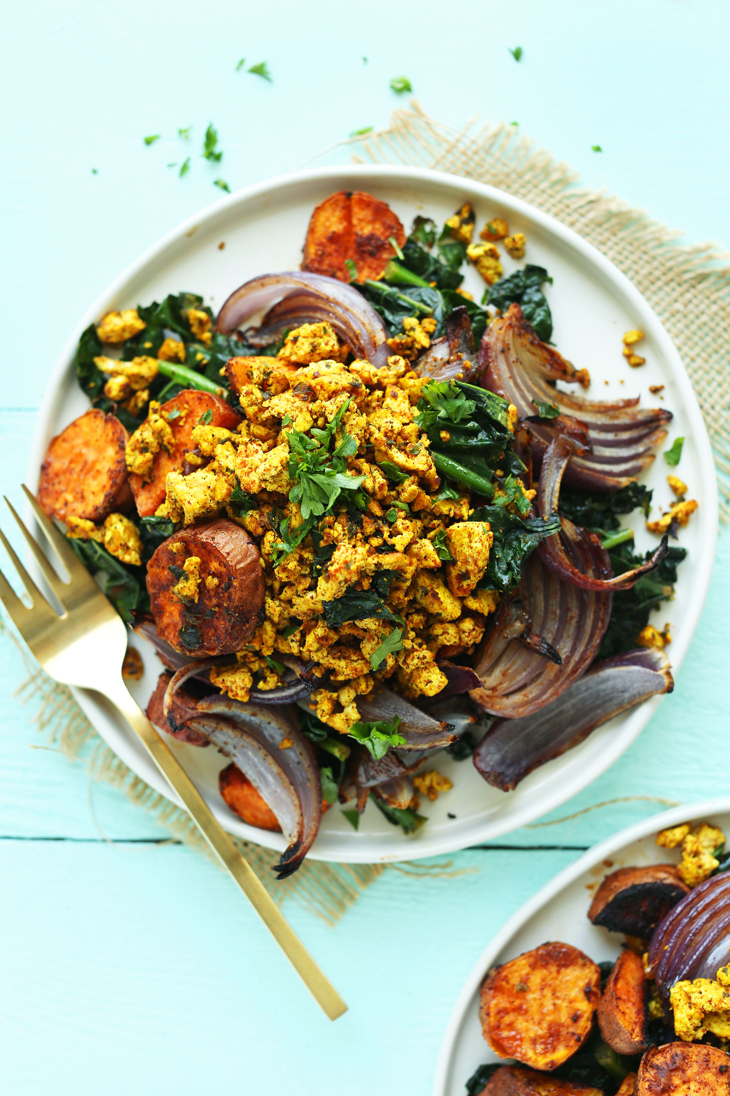 Plate of Savory Tofu Scramble with Kale, Sweet Potatoes, and Roasted Red Onion