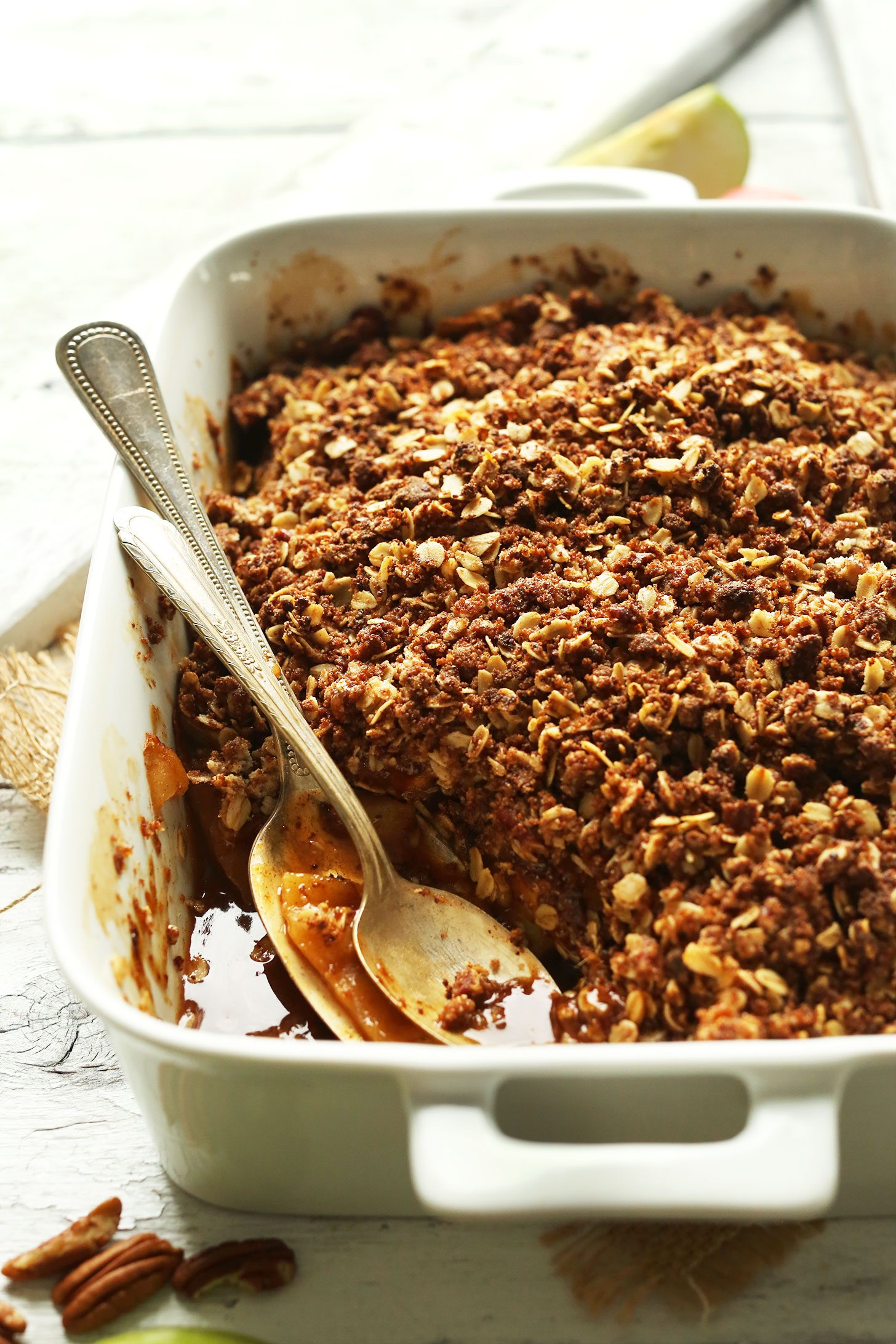 Baking dish filled with the Best Vegan Apple Crisp with a Pecan-Oat Topping