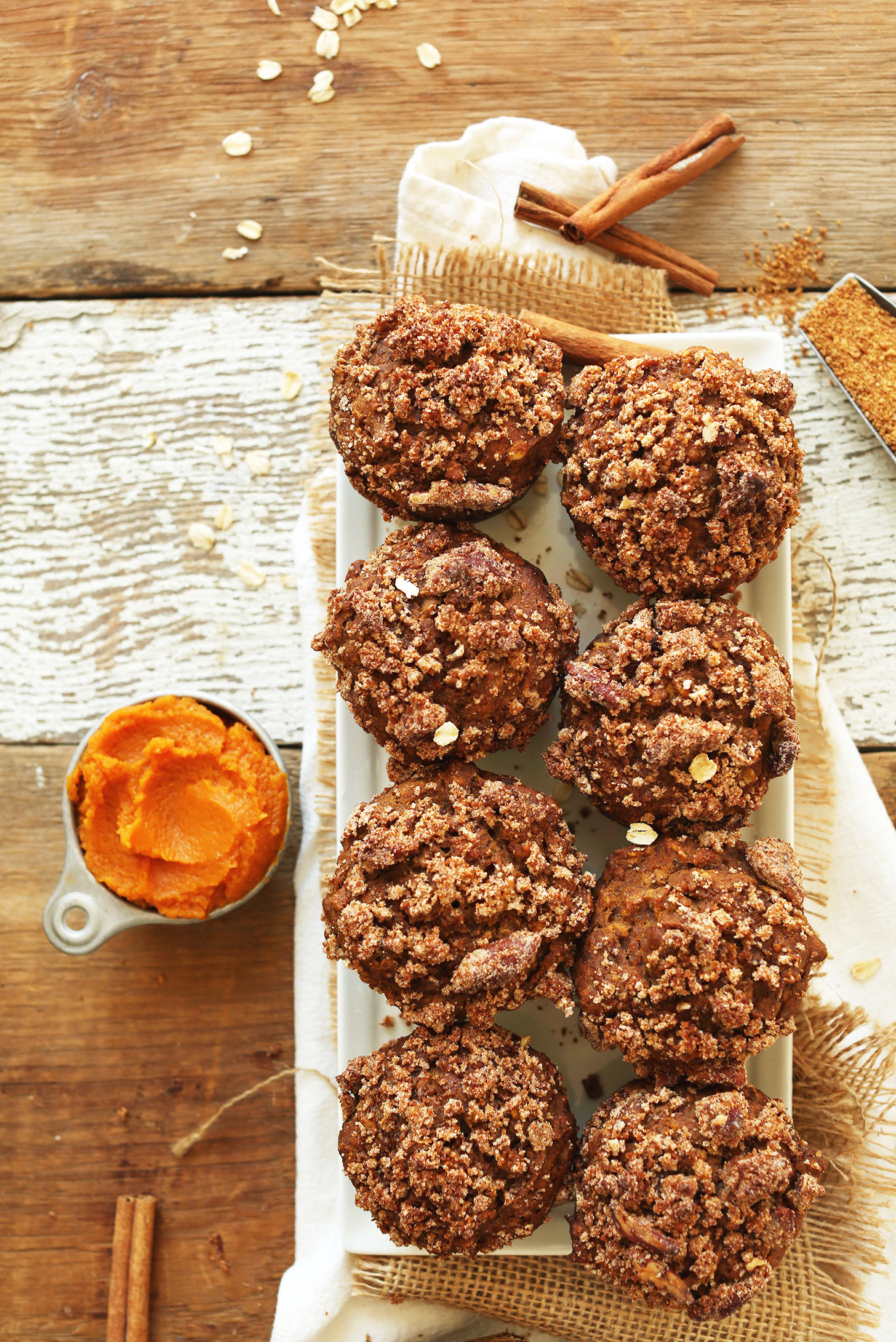 Tray of vegan, gluten-free, and naturally-sweetened Pumpkin Spice Muffins with Pecan Crumble Topping