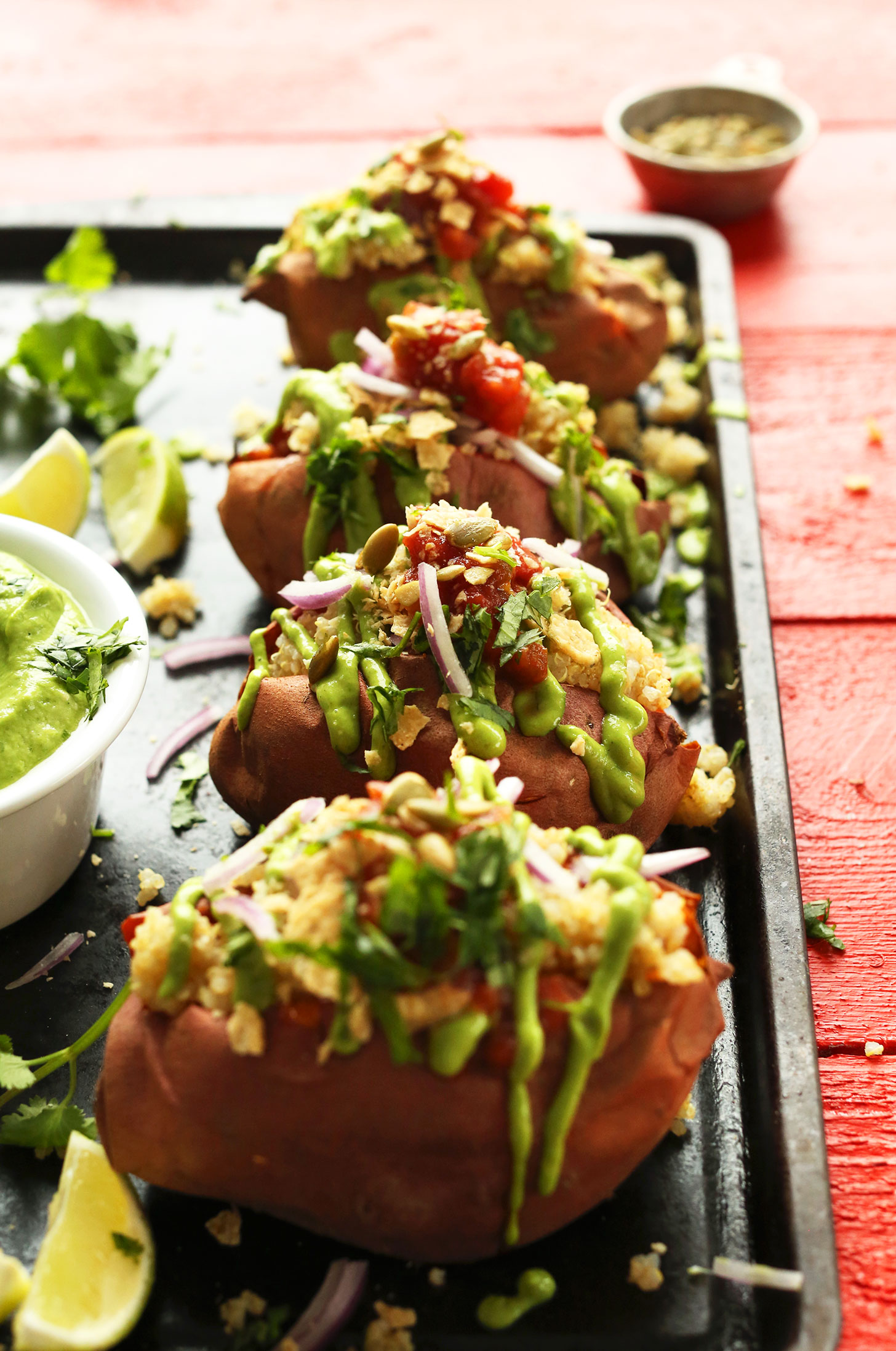Tray of Amazing Quinoa Stuffed Sweet Potatoes loaded with delicious toppings
