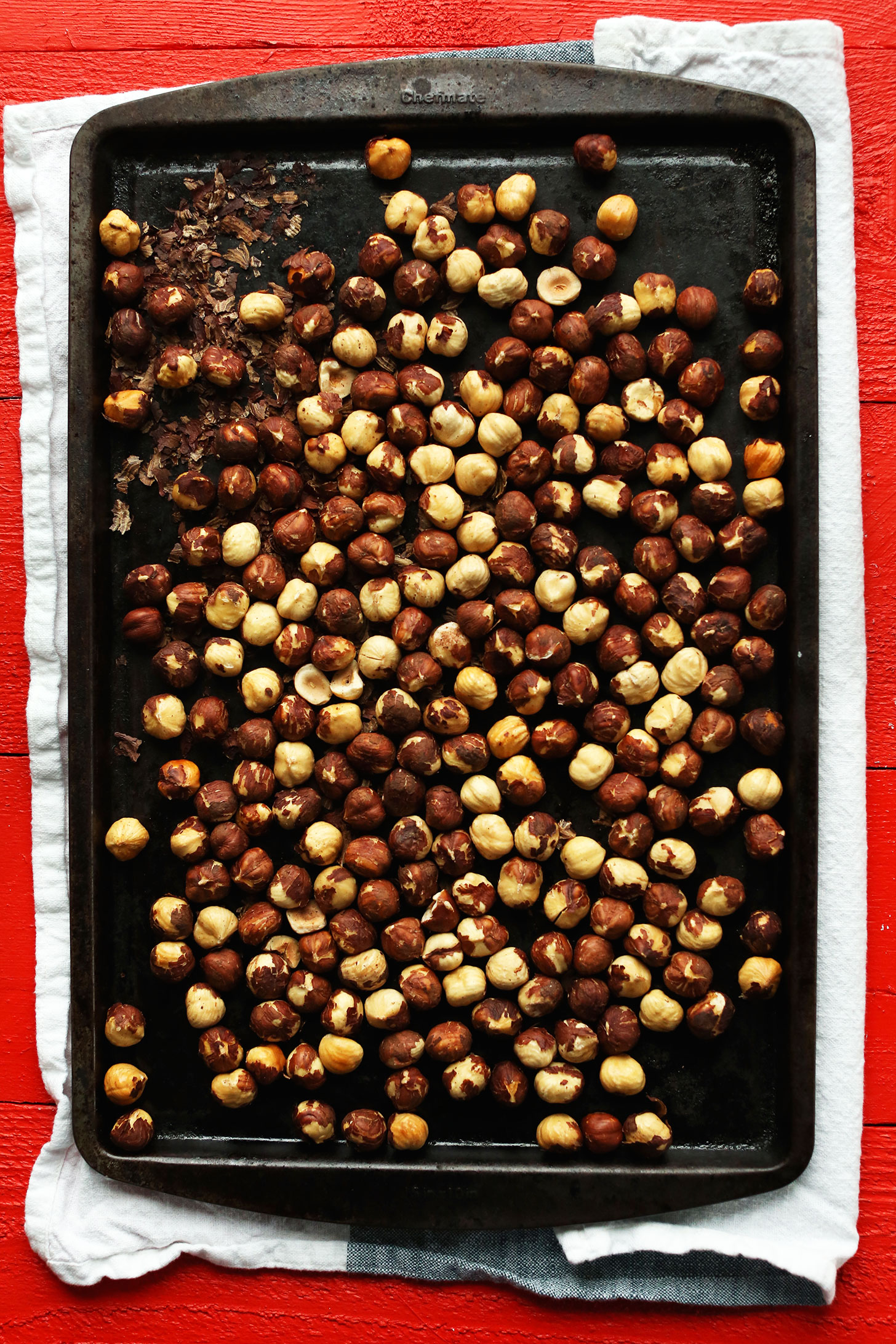 Baking sheet filled with freshly roasted hazelnuts for making Hazelnut Butter