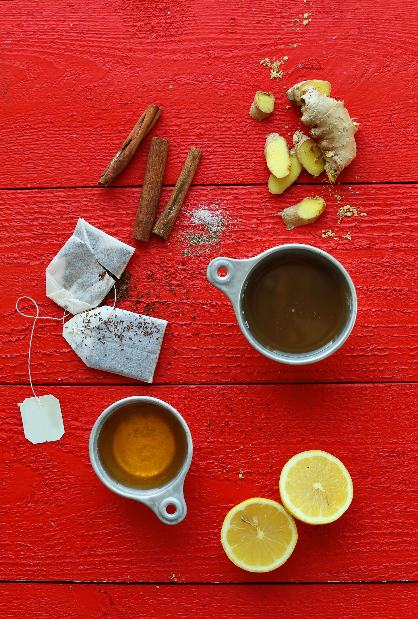 Lemons, cinnamon, ginger, rooibos, apple juice and salt for making our healthy hot toddy recipe