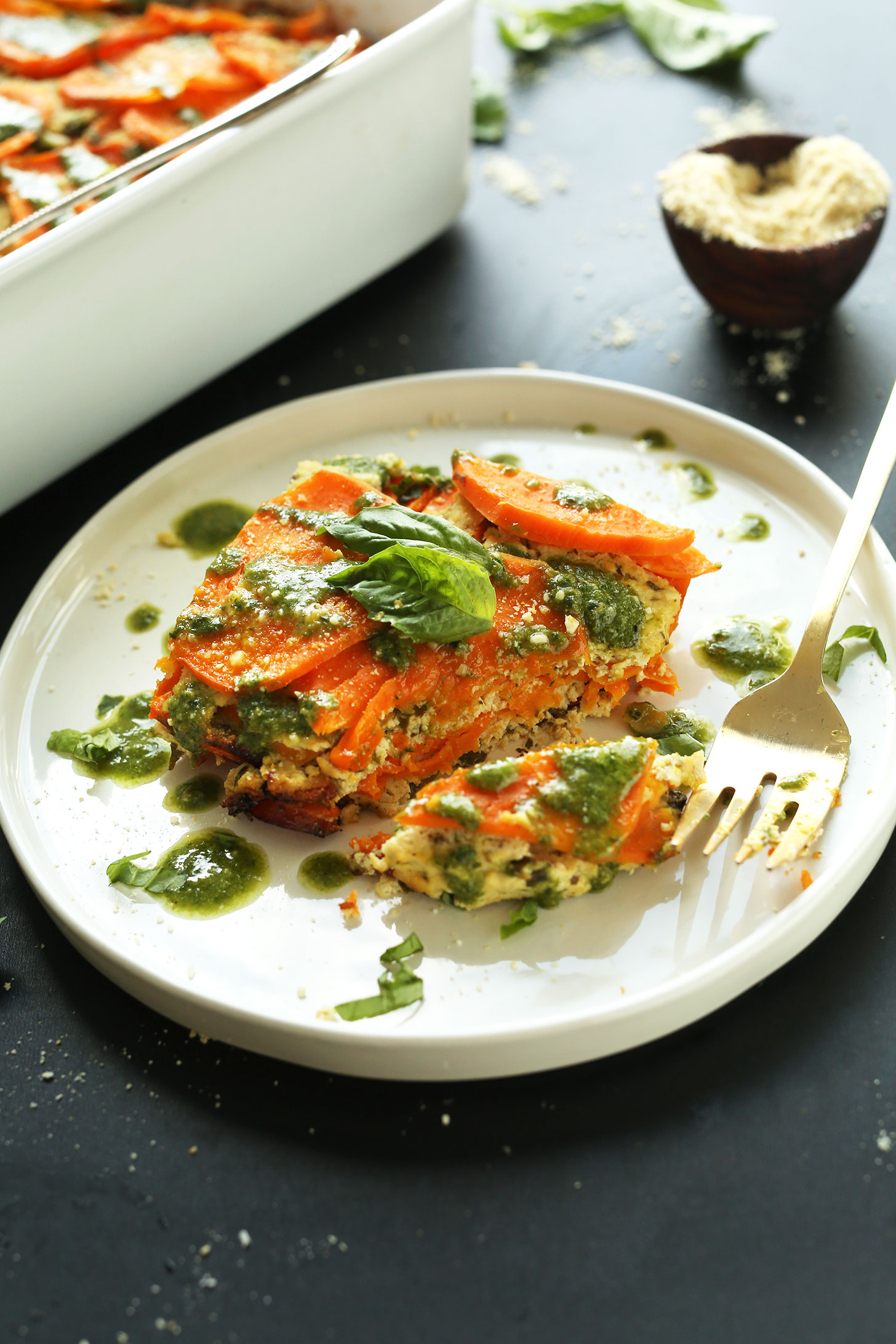 Grabbing a bite of gluten-free vegan Sweet Potato Lasagna for a delicious meal