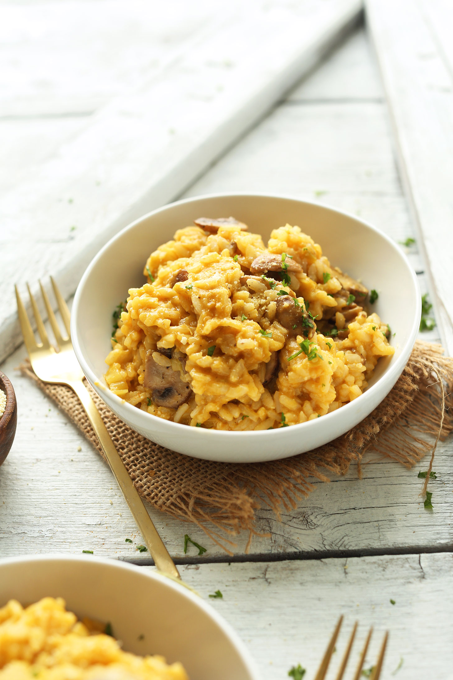 Bowls of our easy vegan risotto with mushrooms and leeks for dinner