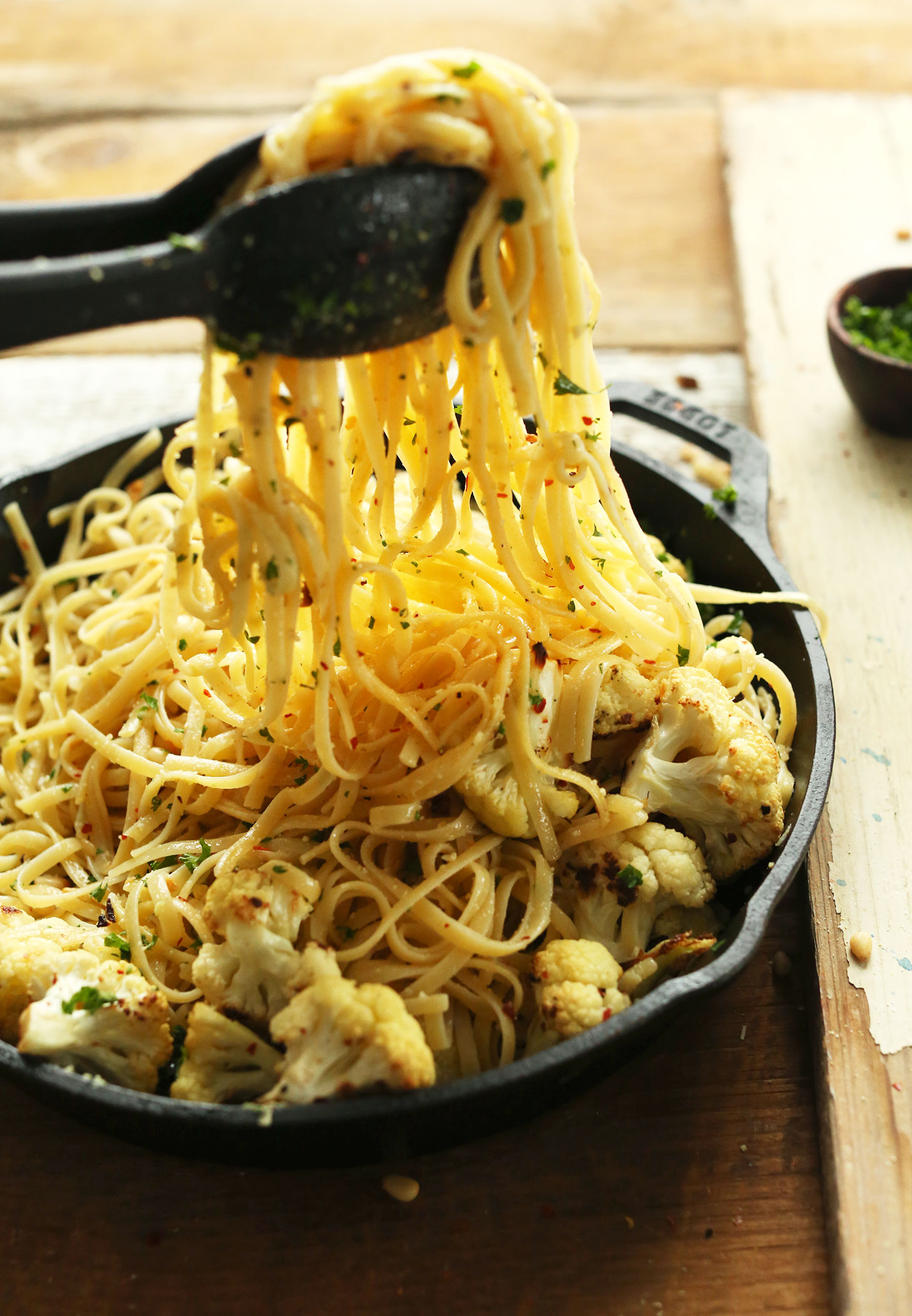 Grabbing a serving of our vegan Linguini in garlic-chili oil for a delicious plant-based dinner
