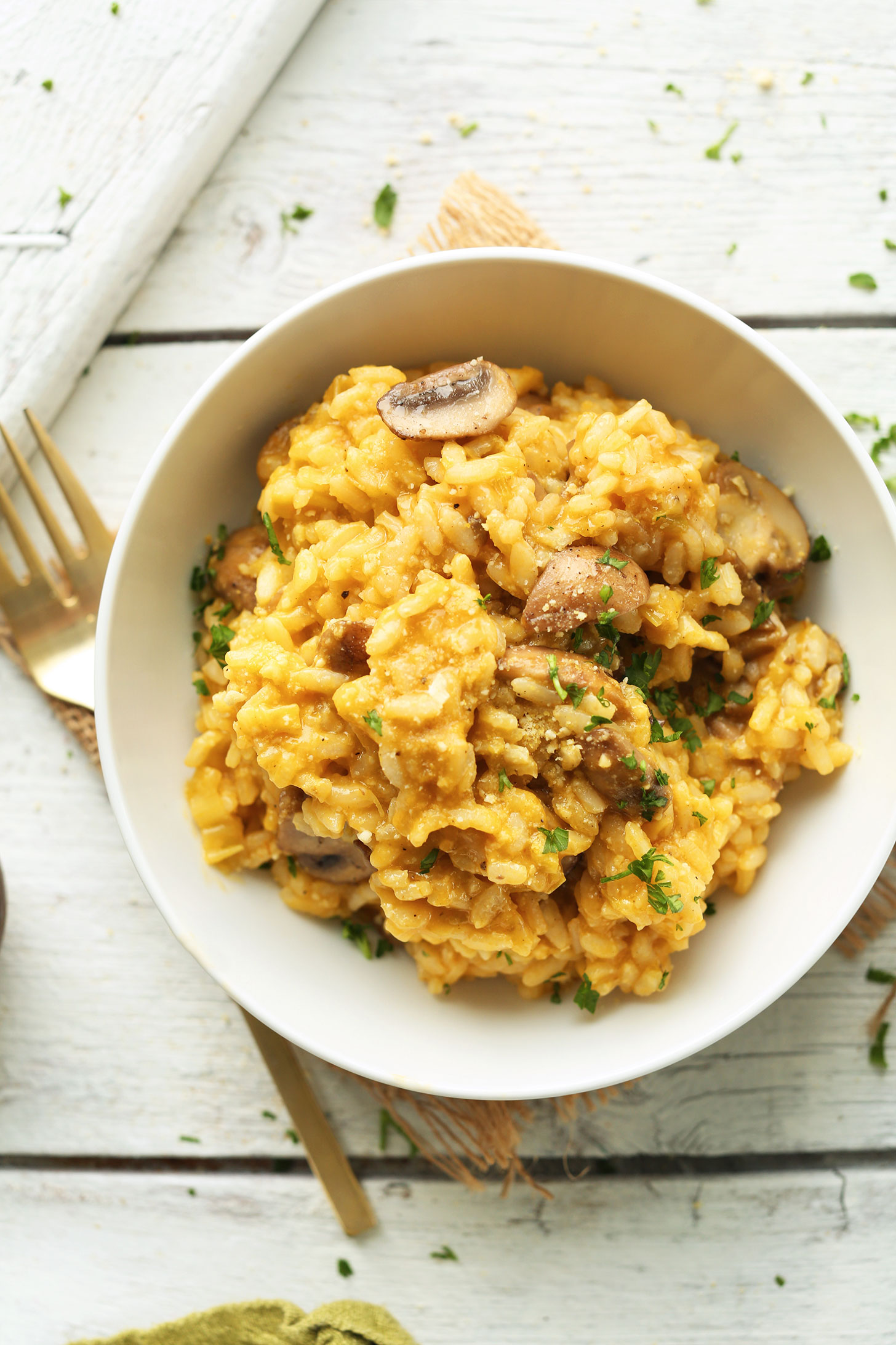 Bowl of our cheesy, comforting gluten-free vegan Risotto with Mushrooms and Leeks