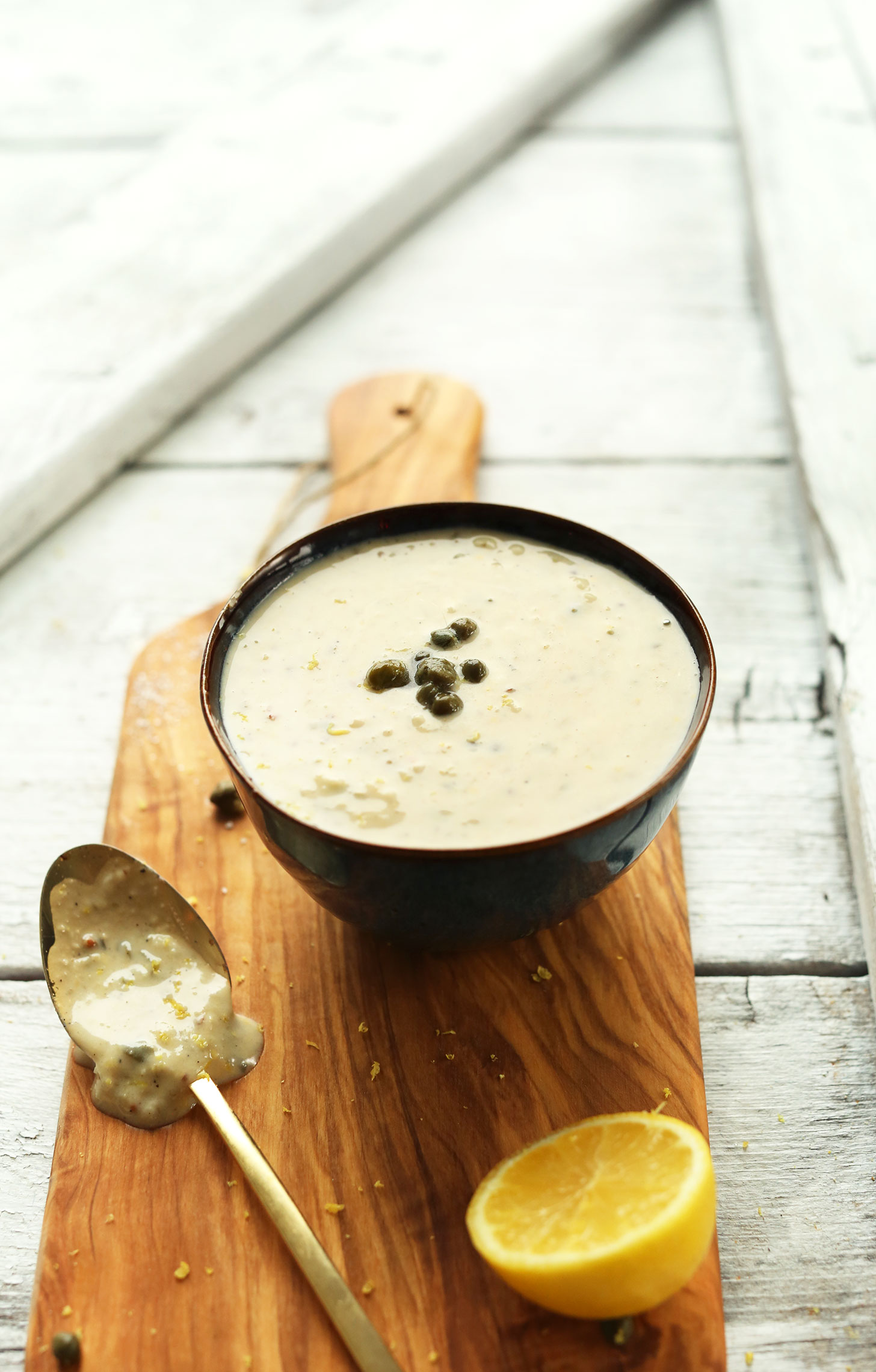 Bowl of our delicious and simple vegan caesar salad dressing recipe