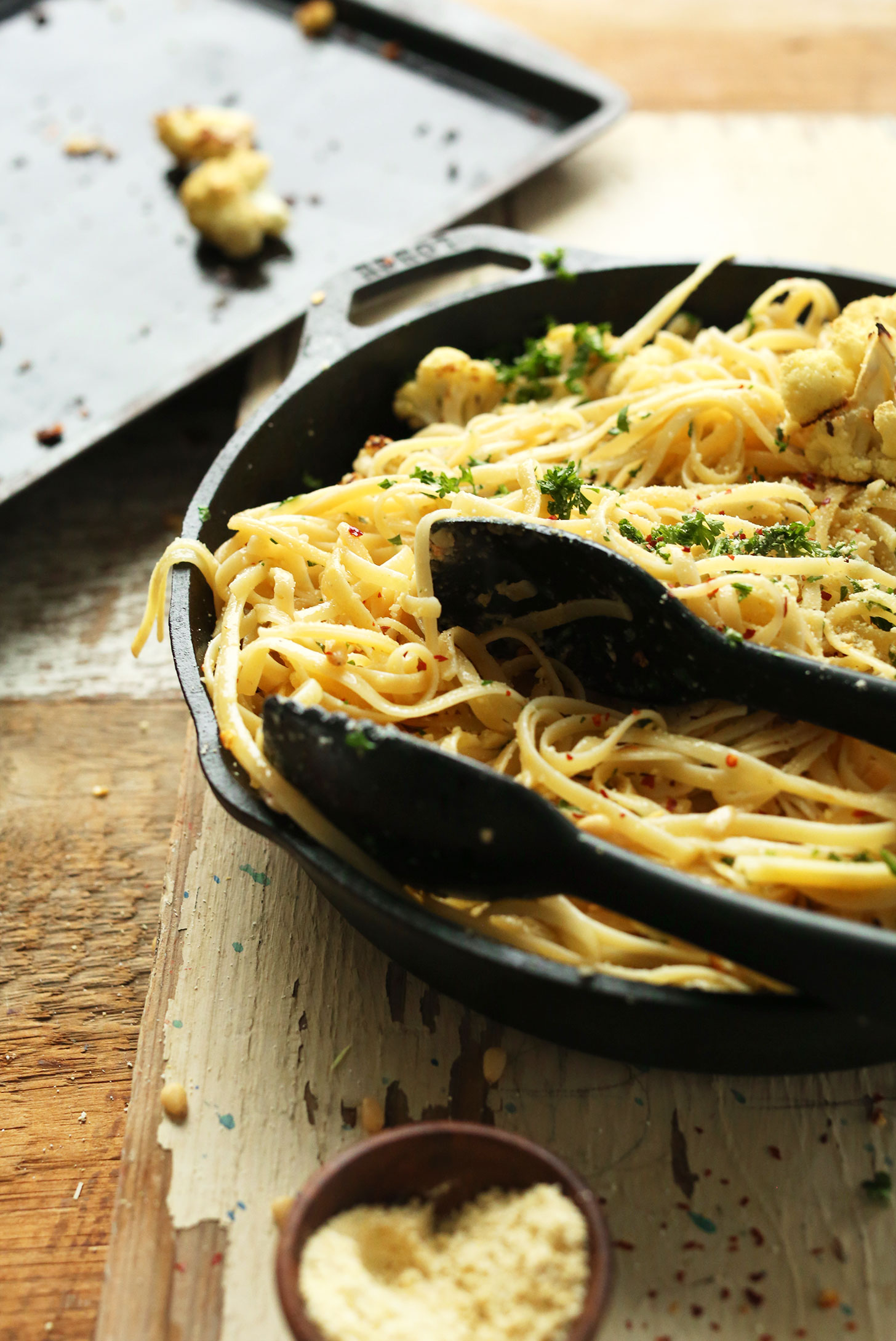 Cast-iron skillet filled with easy vegan Garlicky Spicy Pasta with Roasted Cauliflower