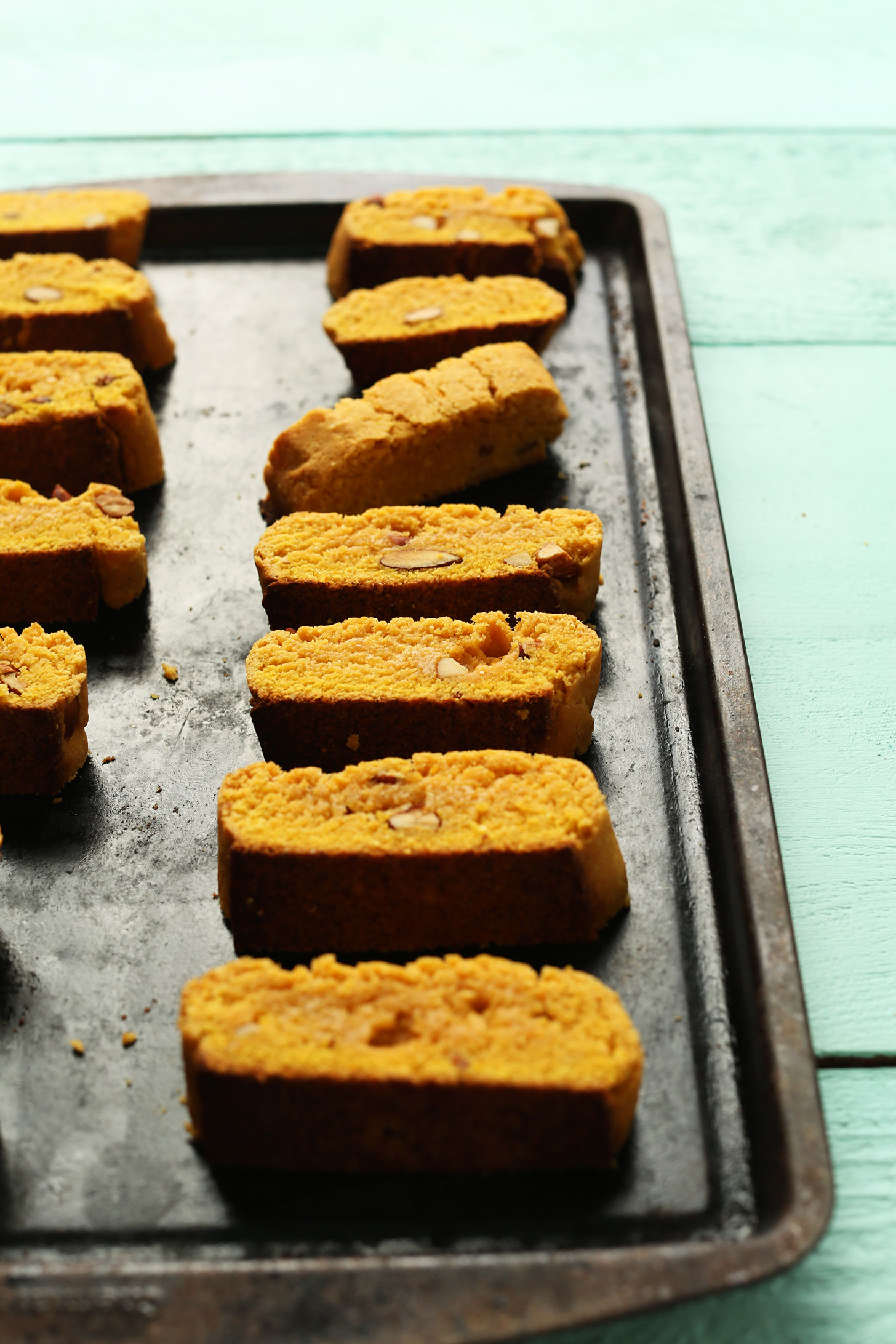 Baking sheet with rows of our vegan Orange Almond Biscotti treats