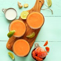Glasses filled with our Papaya Detox Smoothie recipe made with coconut milk and lime