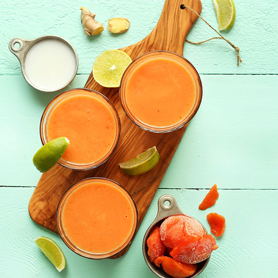 Glasses filled with our Papaya Detox Smoothie recipe made with coconut milk and lime