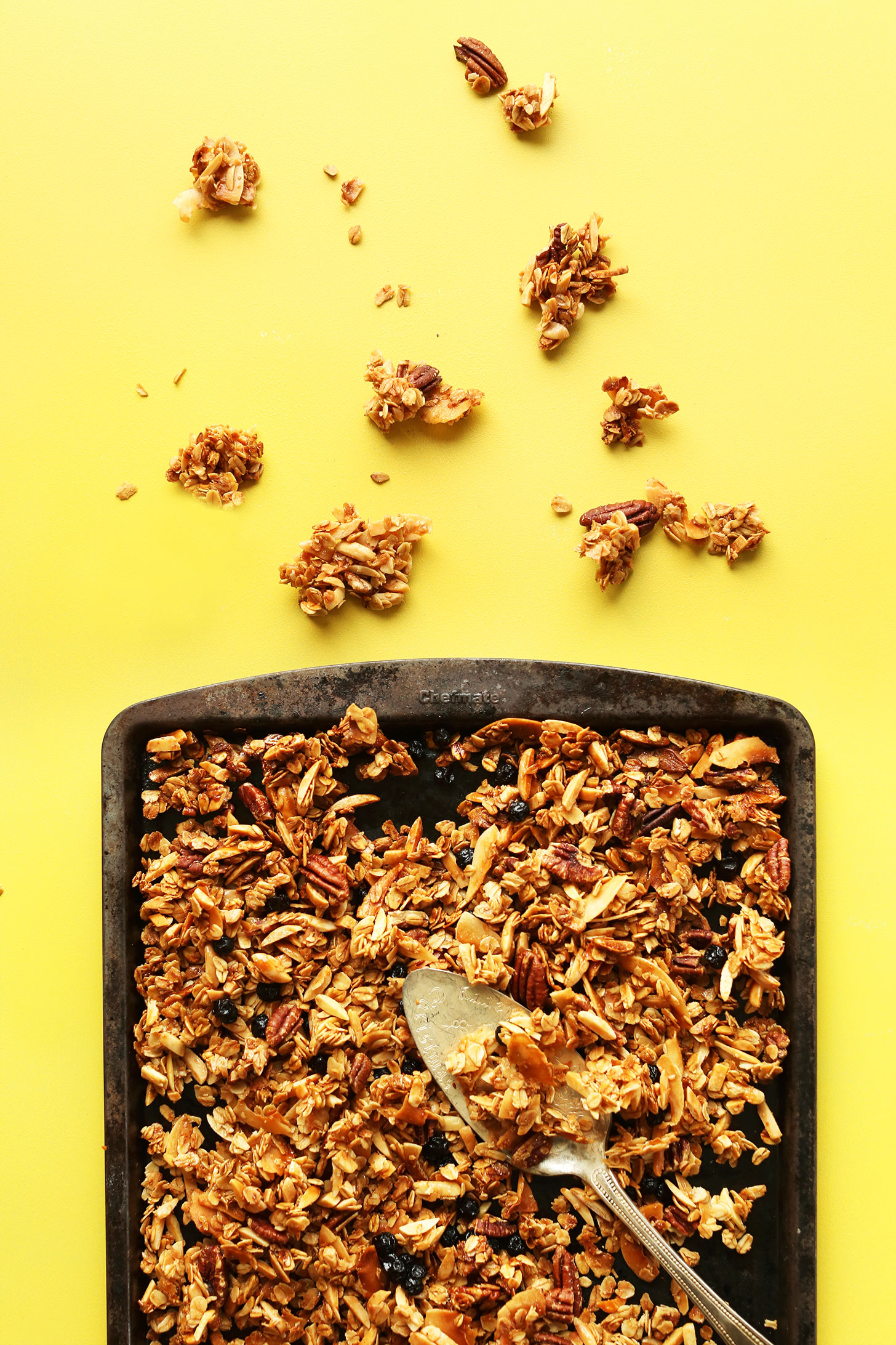 Baking sheet filled with our simple and delicious gluten-free homemade coconut granola