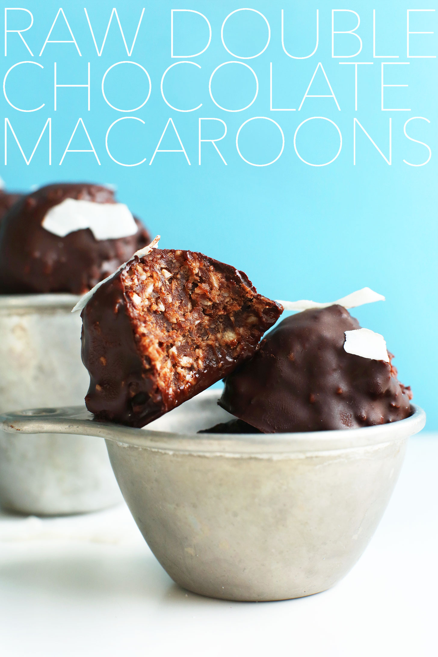 Measuring cup with stack of gluten-free vegan Double Chocolate Raw Macaroons