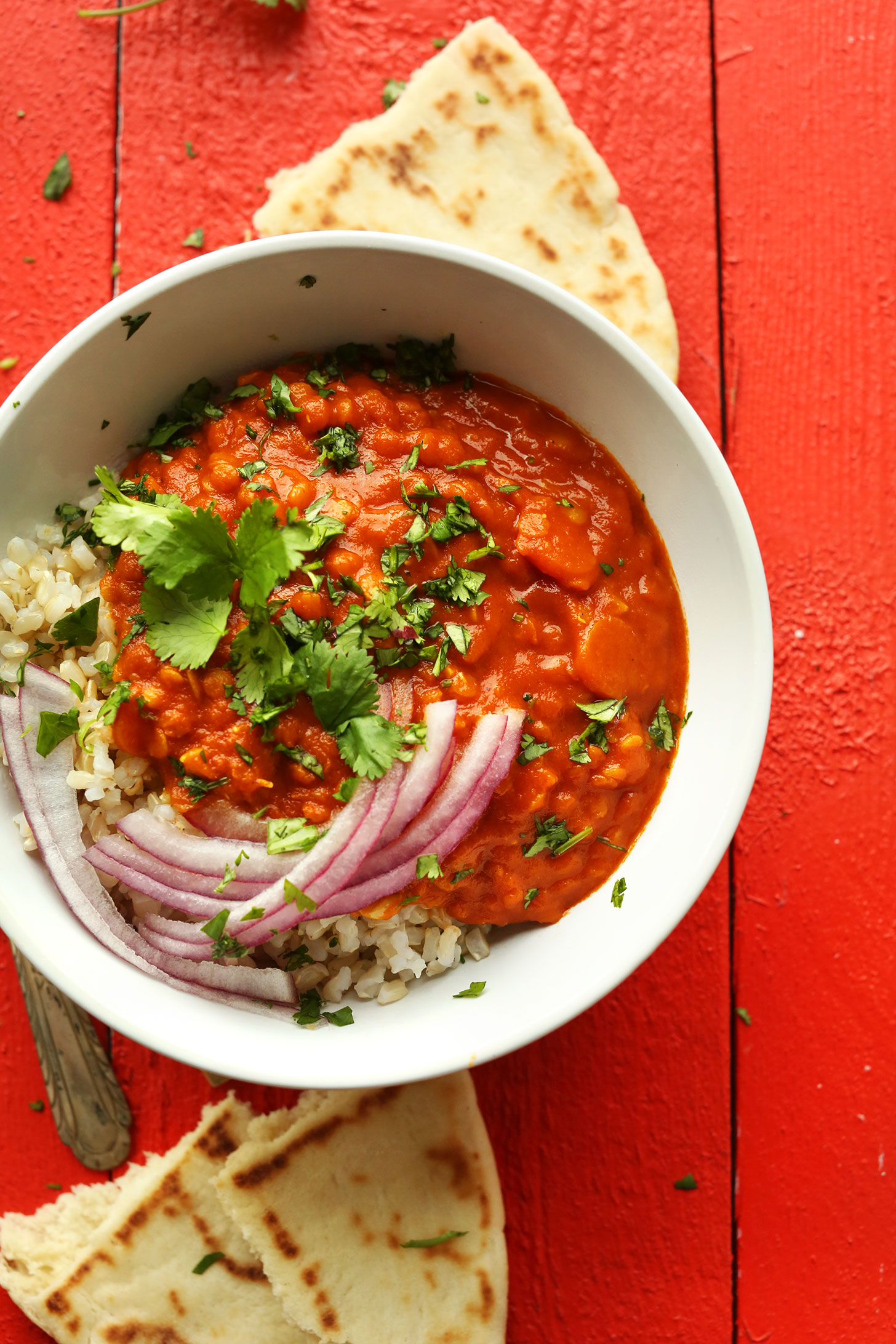 Bowl of our simple 30-minute Red Lentil Curry with ginger, garlic, and carrots
