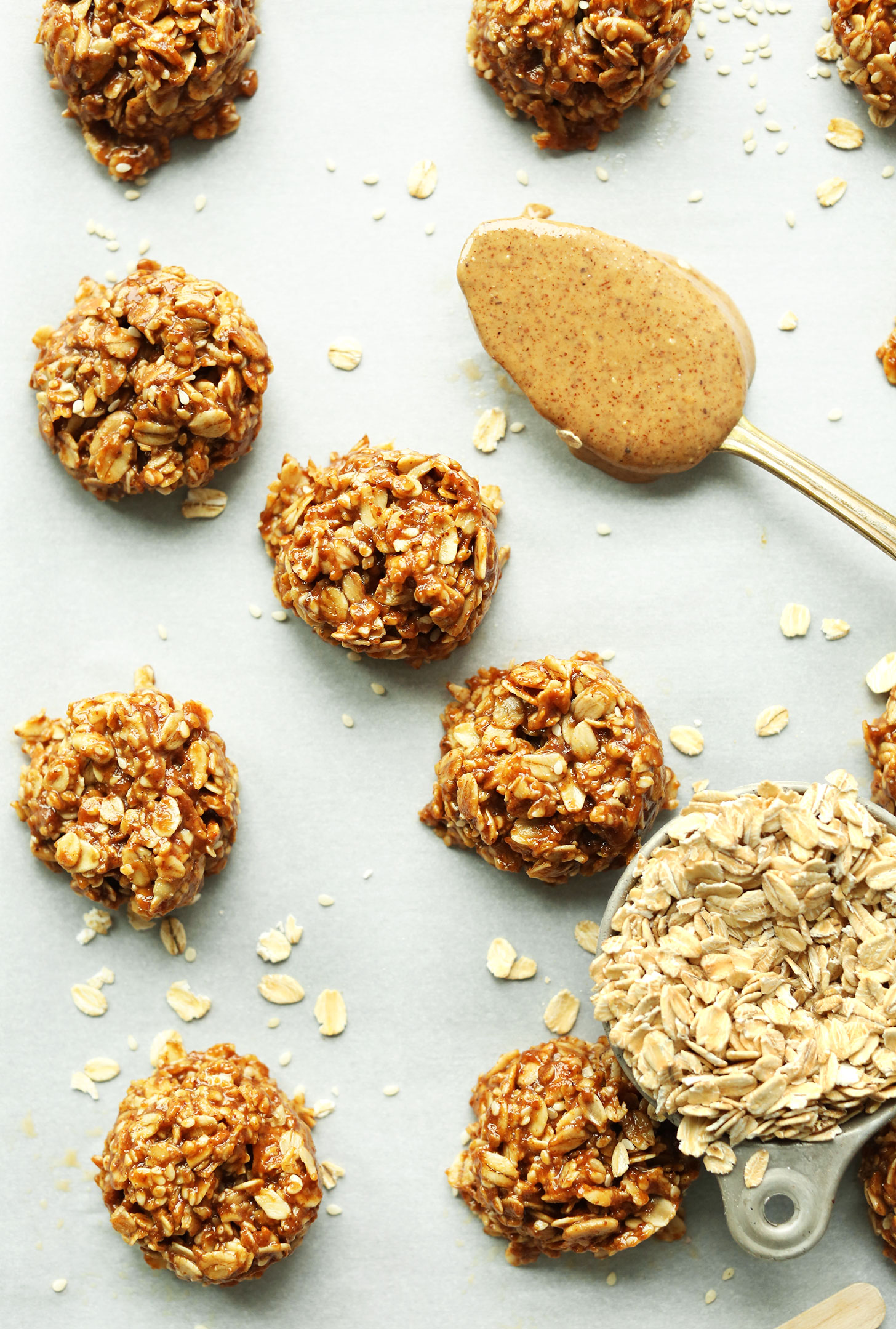 Parchment-lined baking sheet filled with our easy Almond Butter No-Bake Cookies