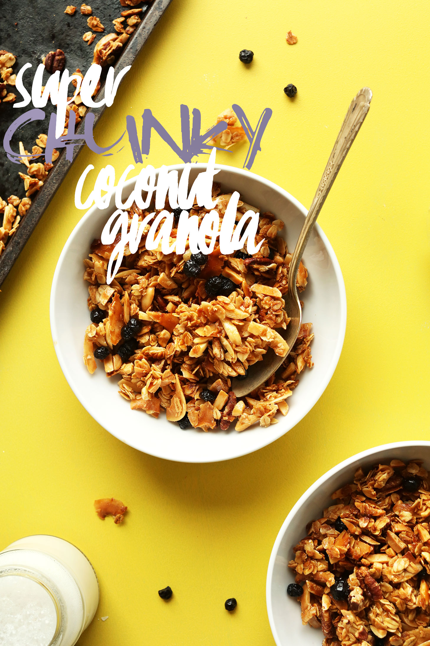 Bowls of gluten-free vegan super chunky coconut granola with dried blueberries