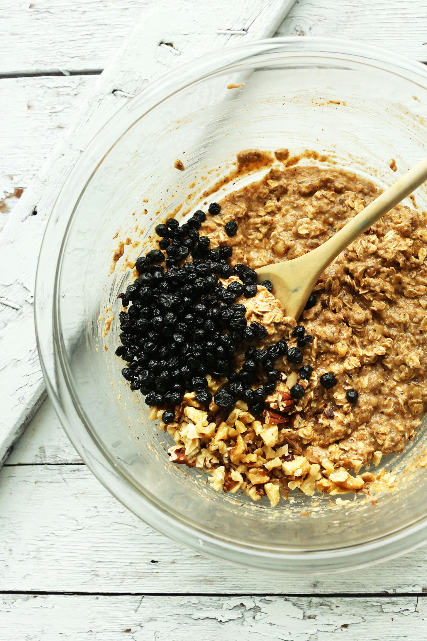 Stirring dried blueberries into our healthy blueberry muffin breakfast cookies recipe