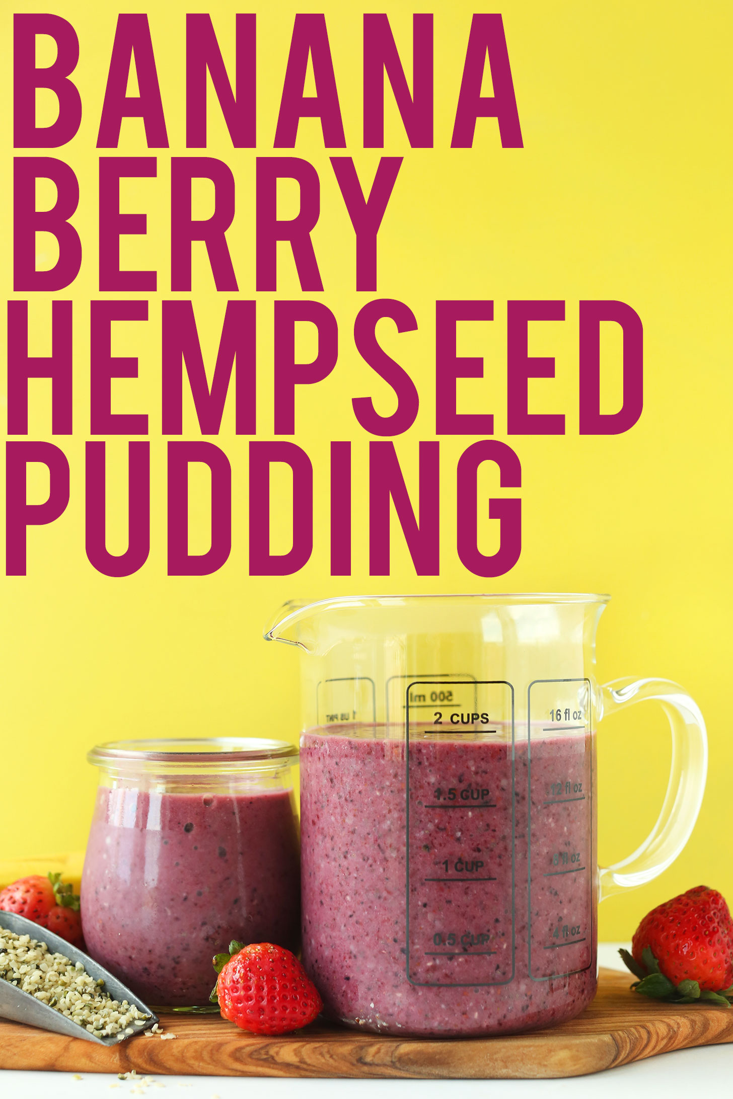 Measuring glass and jar filled with our gluten-free vegan Banana Berry Hempseed Pudding