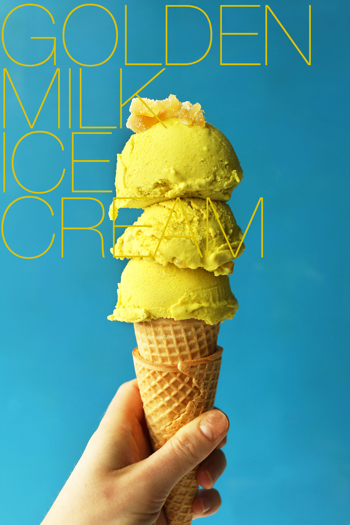Sugar cone topped with scoops of our homemade vegan Golden Milk Ice Cream