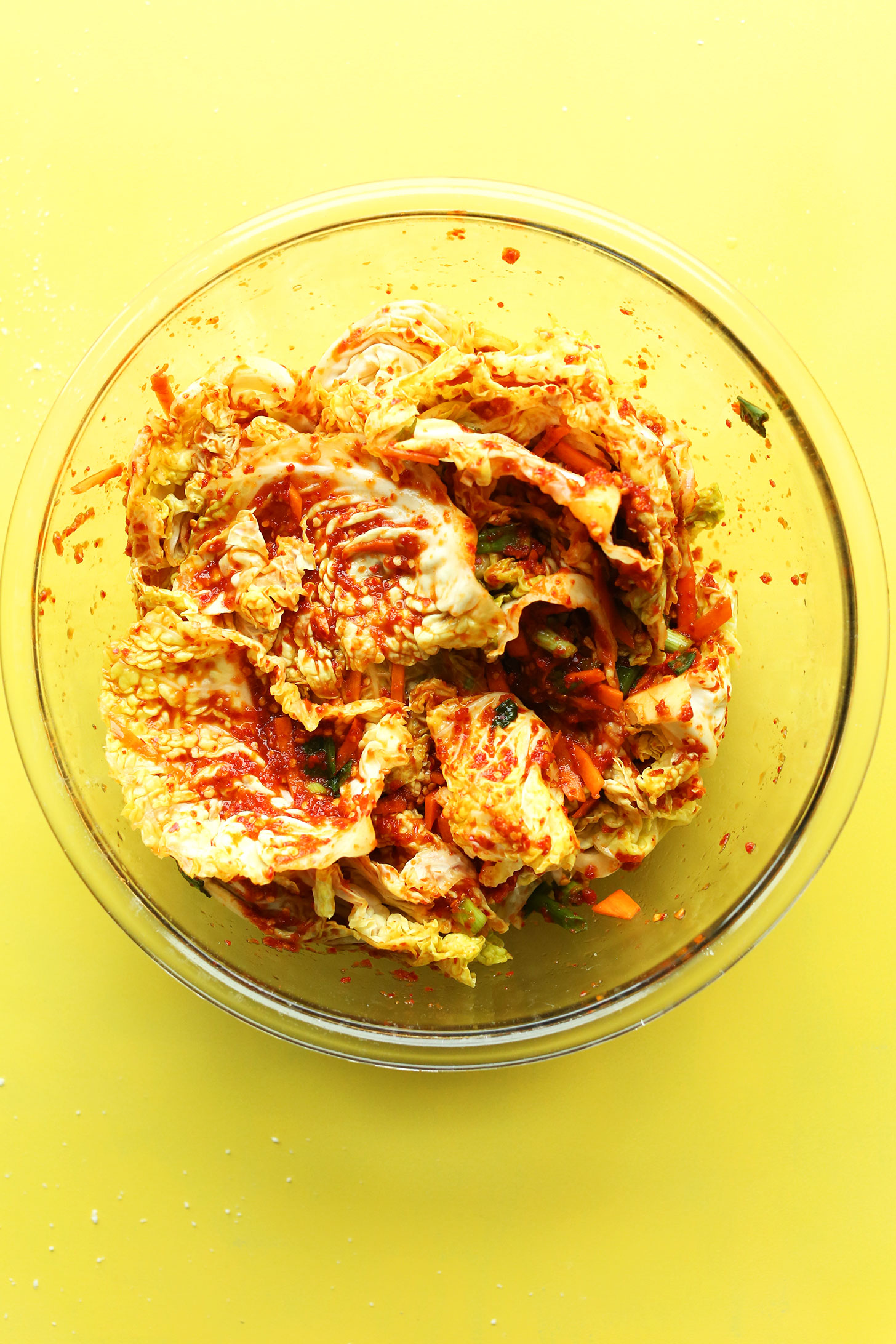 Bowl with ingredients mixed together for our easy vegan kimchi recipe