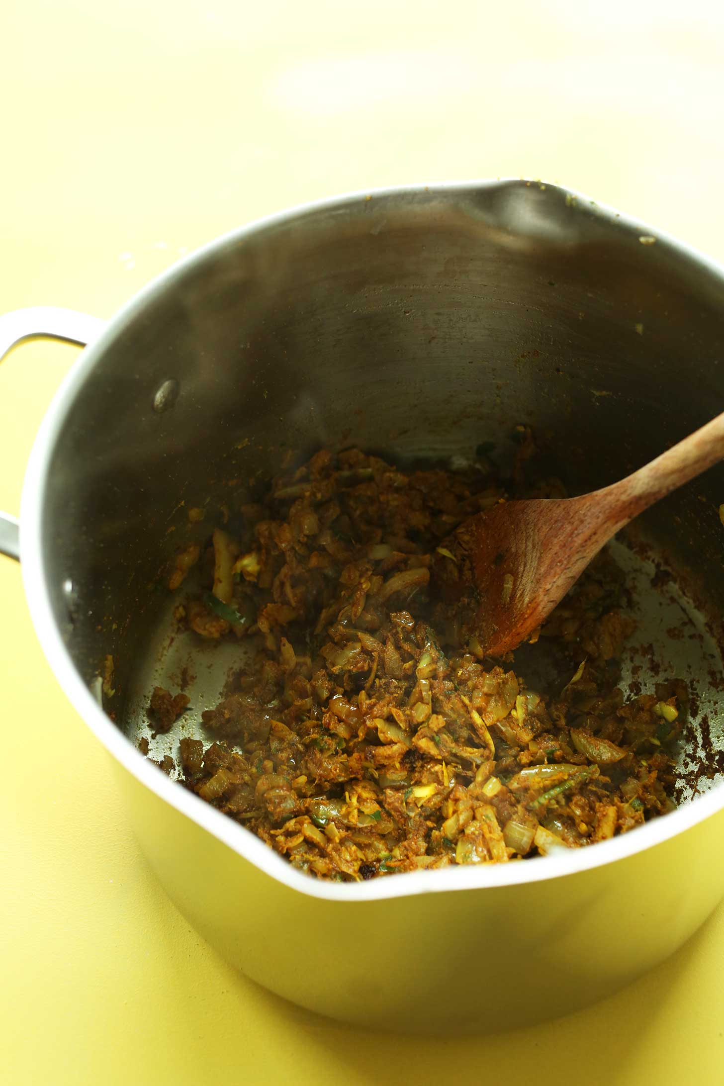 Sautéing ingredients for making flavorful, healthy, vegan Chana Masala
