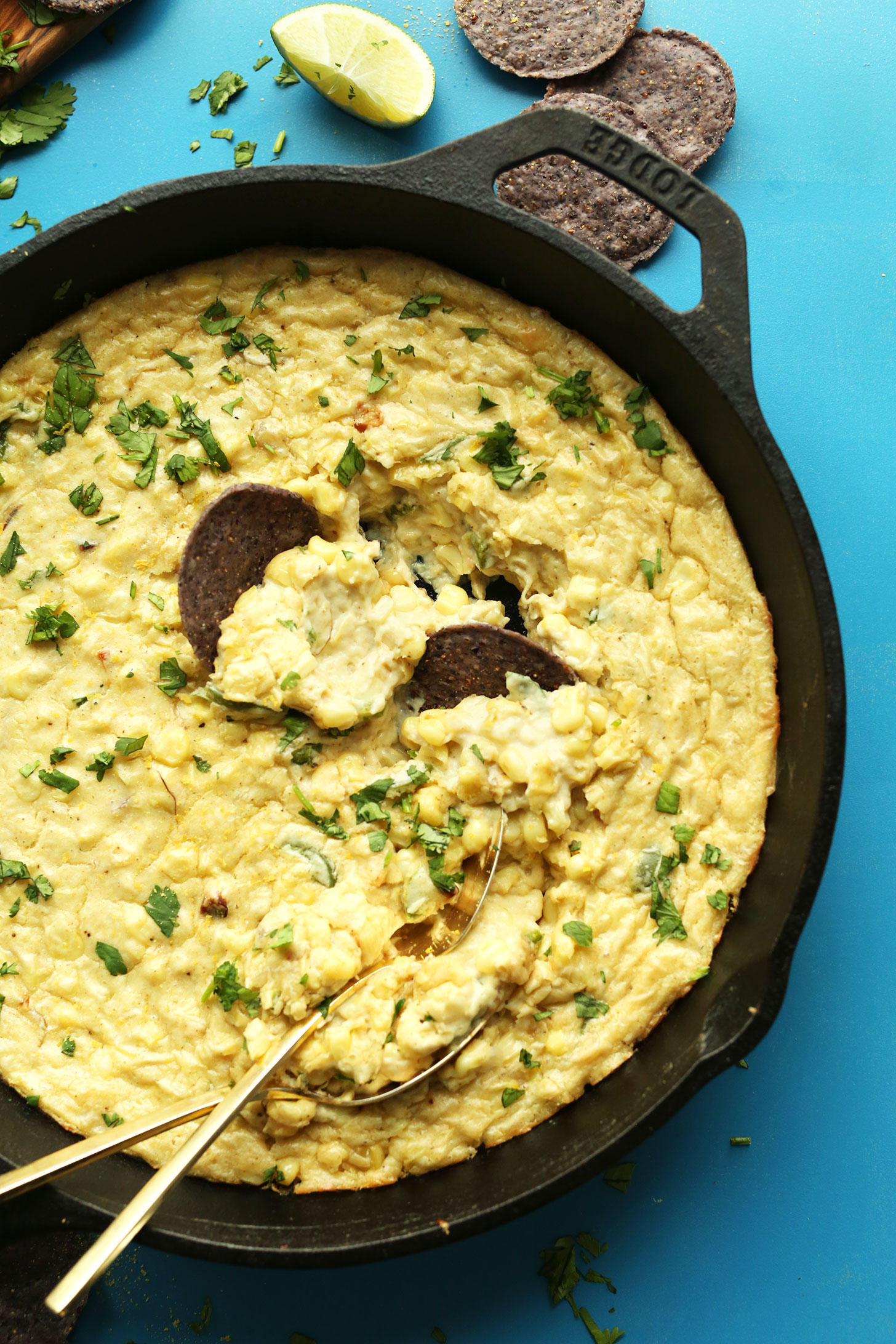 Cast-iron skillet filled with our delicious vegan Cheesy Corn Dip with Jalapenos
