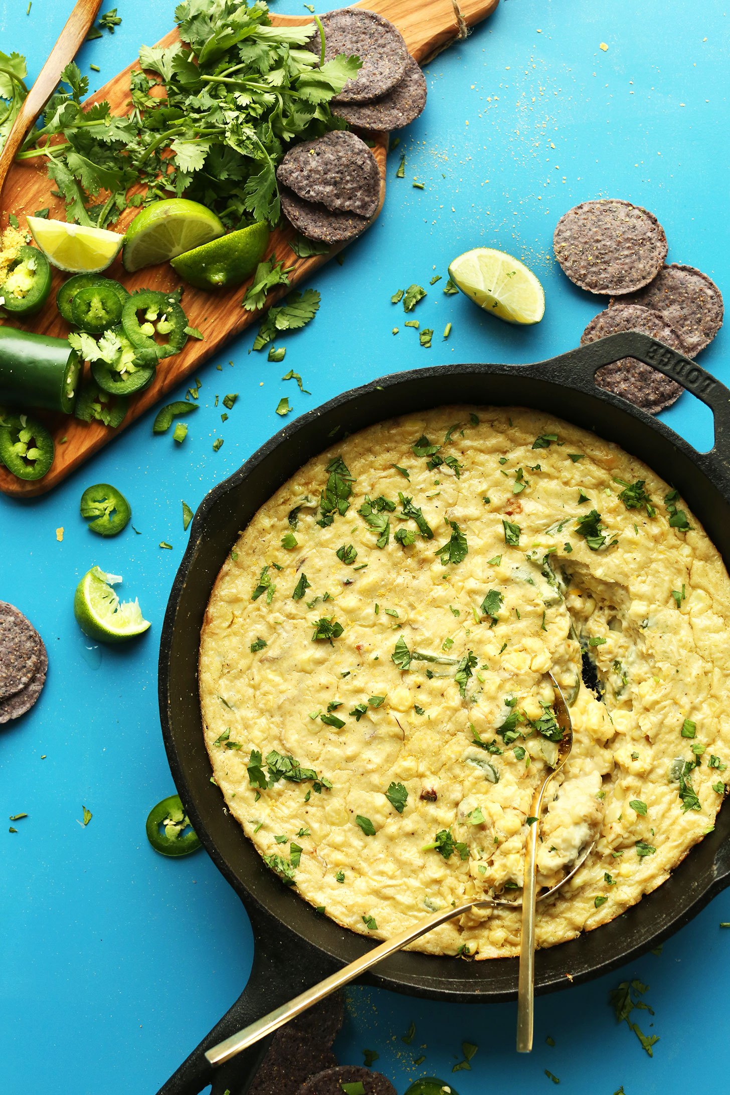 Cast-iron skillet filled with Cheesy Corn Dip for a gluten-free plant-based appetizer